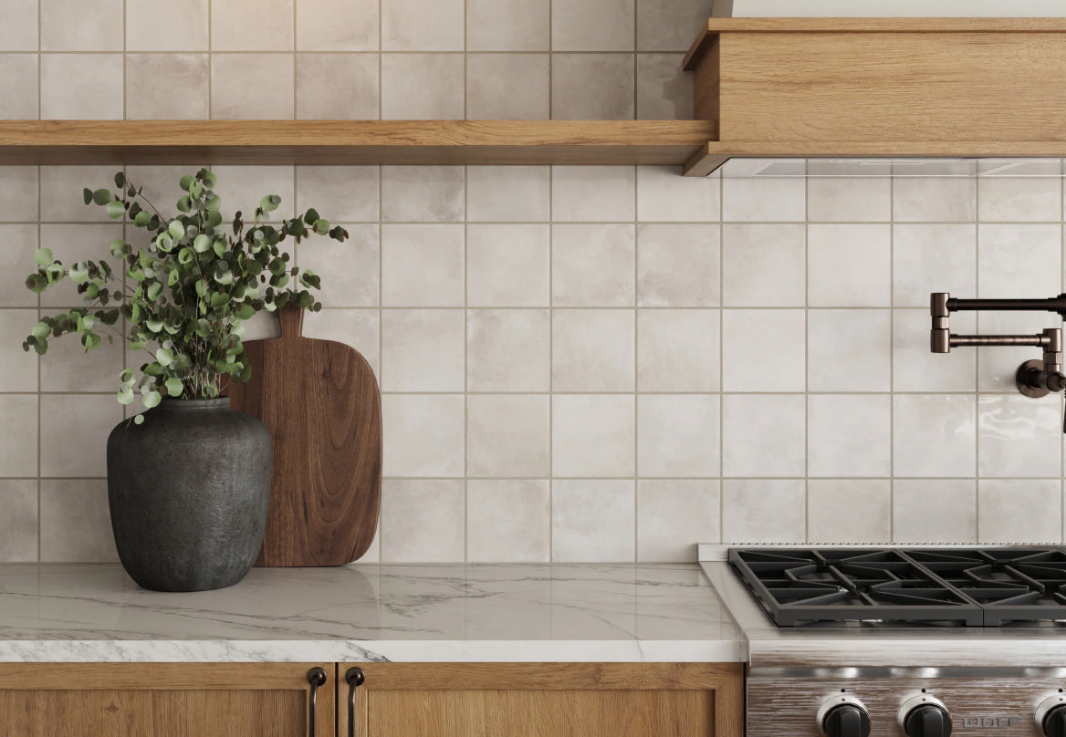 Elegant taupe kitchen tiles creating a smooth, neutral backdrop, perfectly paired with wooden cabinetry and marble countertops