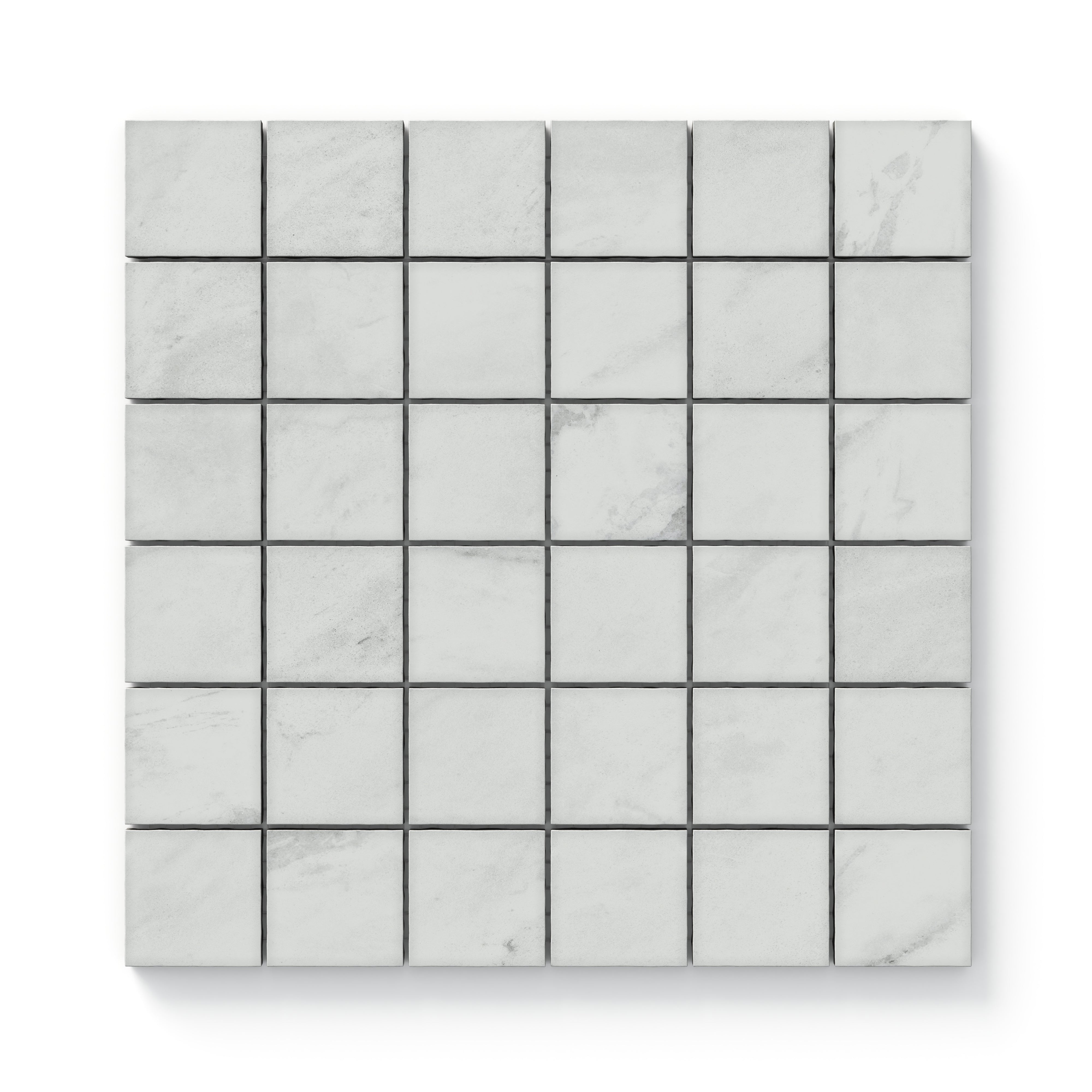 White matte mosaic tiles in a 2x2 grid, featuring soft white and grey marble-inspired veining for a clean and timeless look.