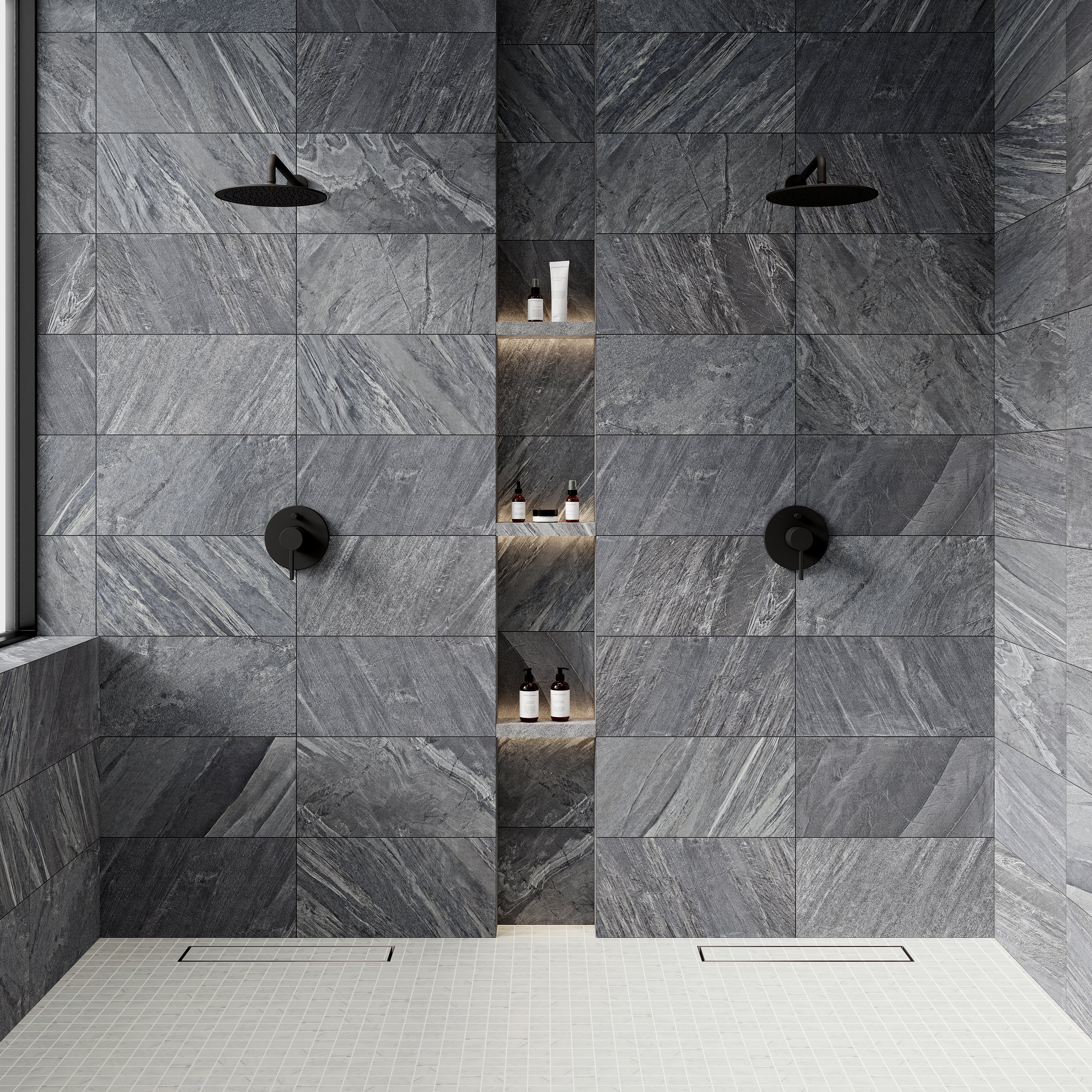 Contemporary shower featuring Reynir Iron matte porcelain tiles in deep gray tones with dynamic veining, paired with recessed shelving and sleek black fixtures.