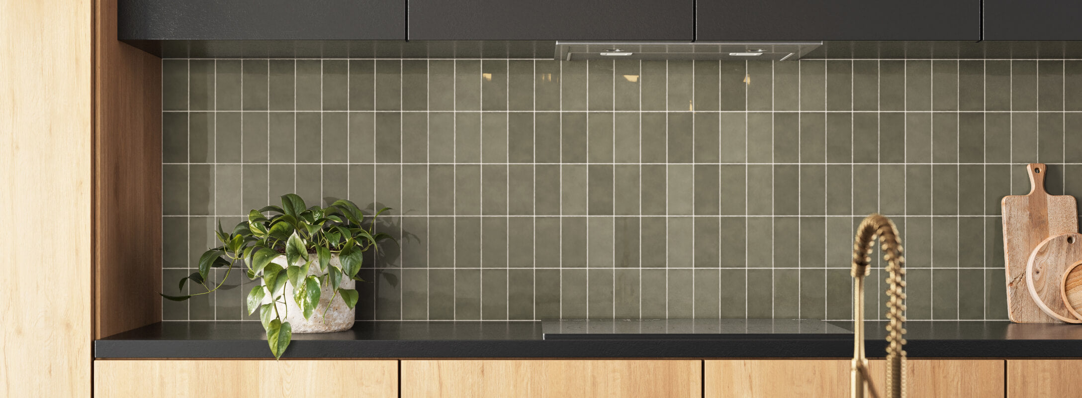 A sleek kitchen backsplash featuring glossy green square tiles with light grout lines, beautifully complementing the wooden cabinets and modern decor