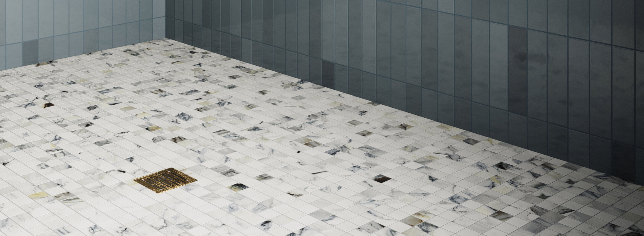 White marble mosaic tiles with subtle blue veining create an elegant shower floor, complemented by vertical dark blue wall tiles