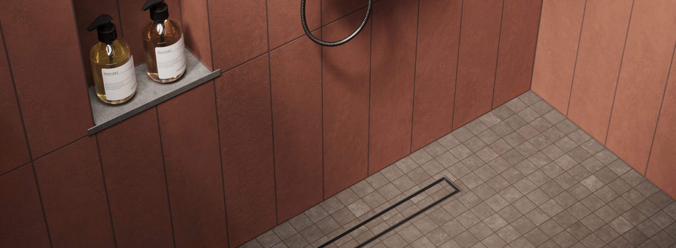 Modern shower with rich red-brown textured wall tiles, paired with brown mosaic floor tiles and a sleek built-in shelf for toiletries