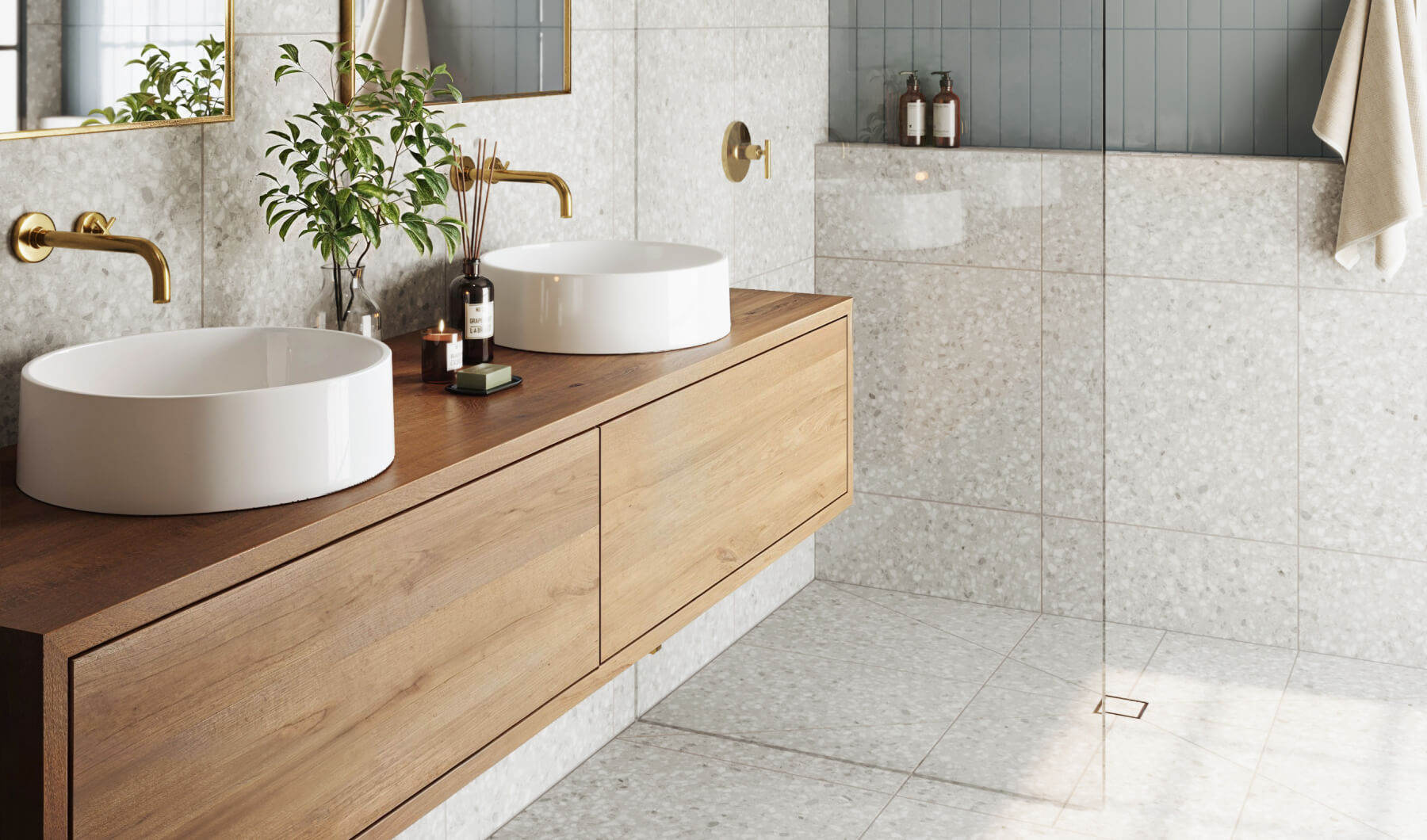 Elegant bathroom featuring light grey terrazzo wall tiles complemented by sleek wooden cabinetry and chic white basin sinks