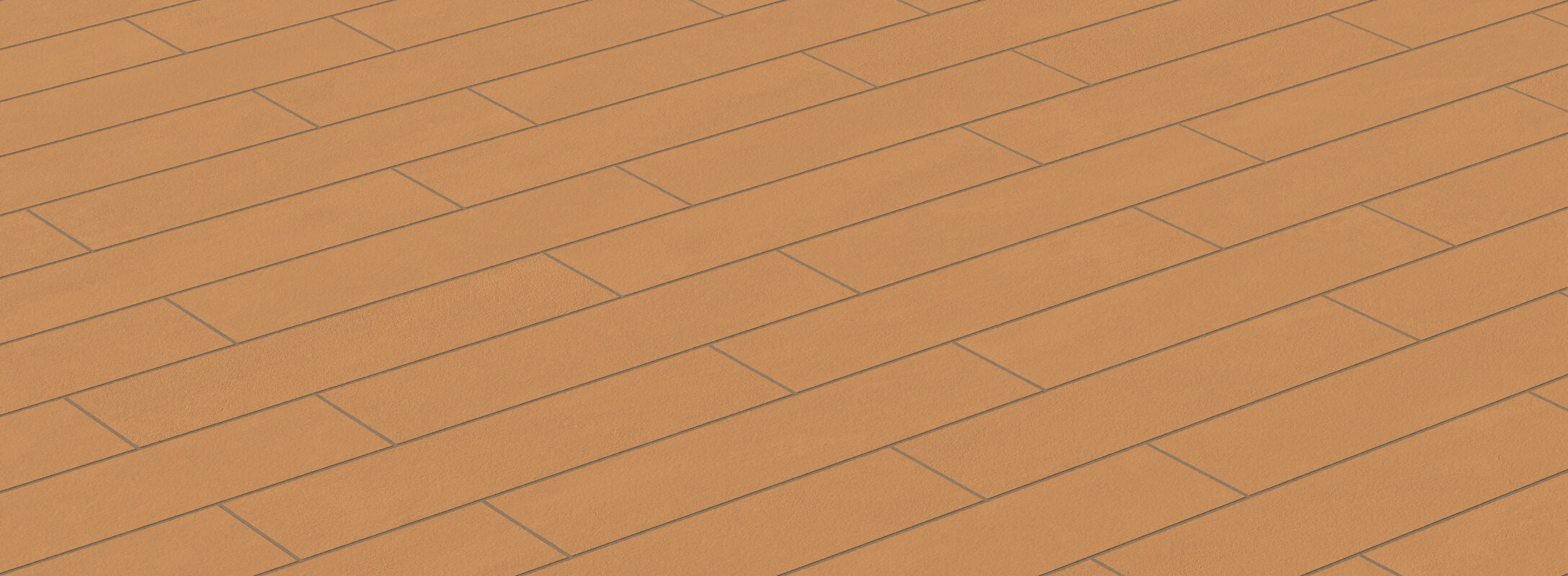 Earthy orange tiles arranged in a classic herringbone pattern, providing a vibrant yet rustic look to any surface