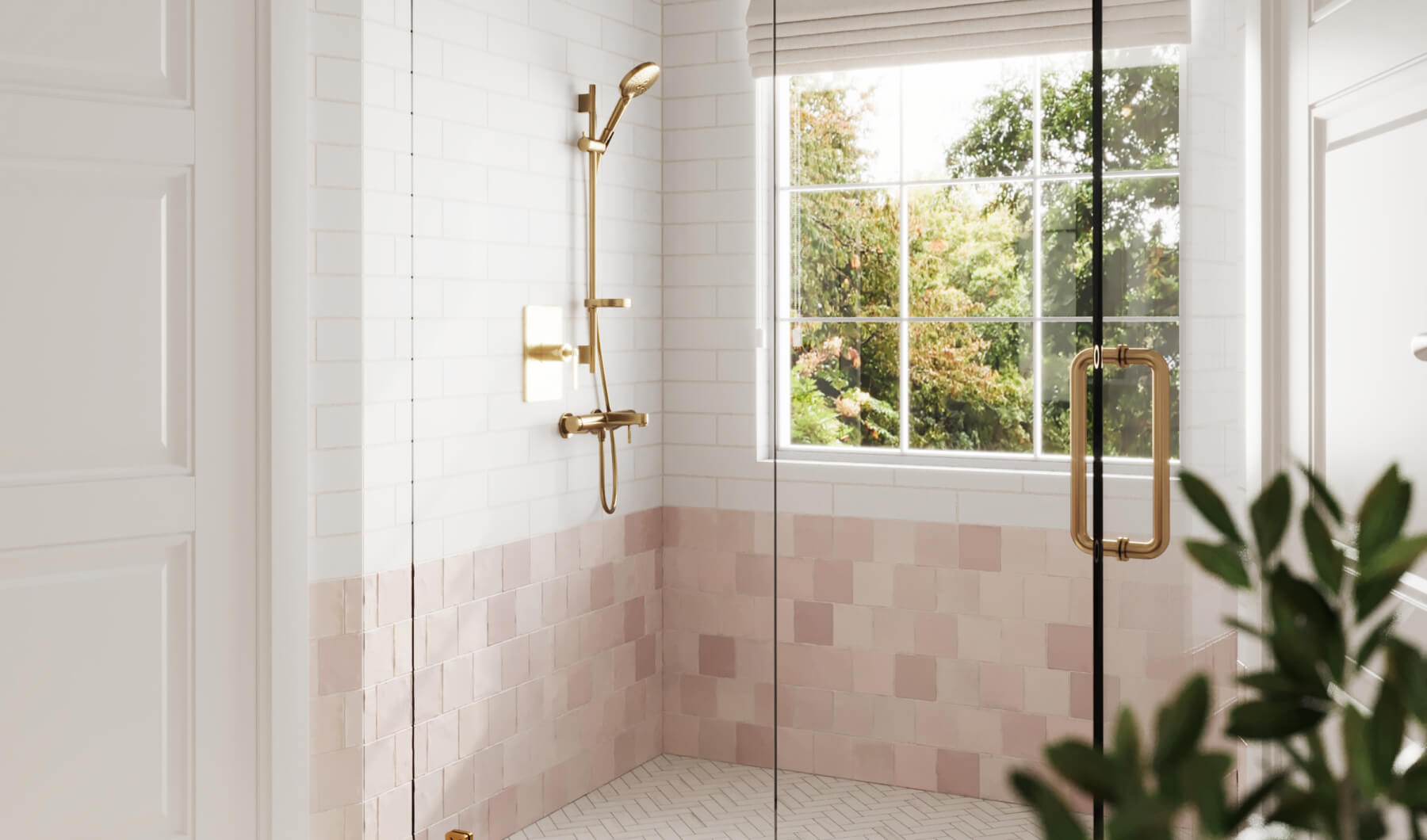 Bright bathroom with white subway tiles and blush red tiles, featuring a gold shower fixture and a large window, creating a fresh and elegant look