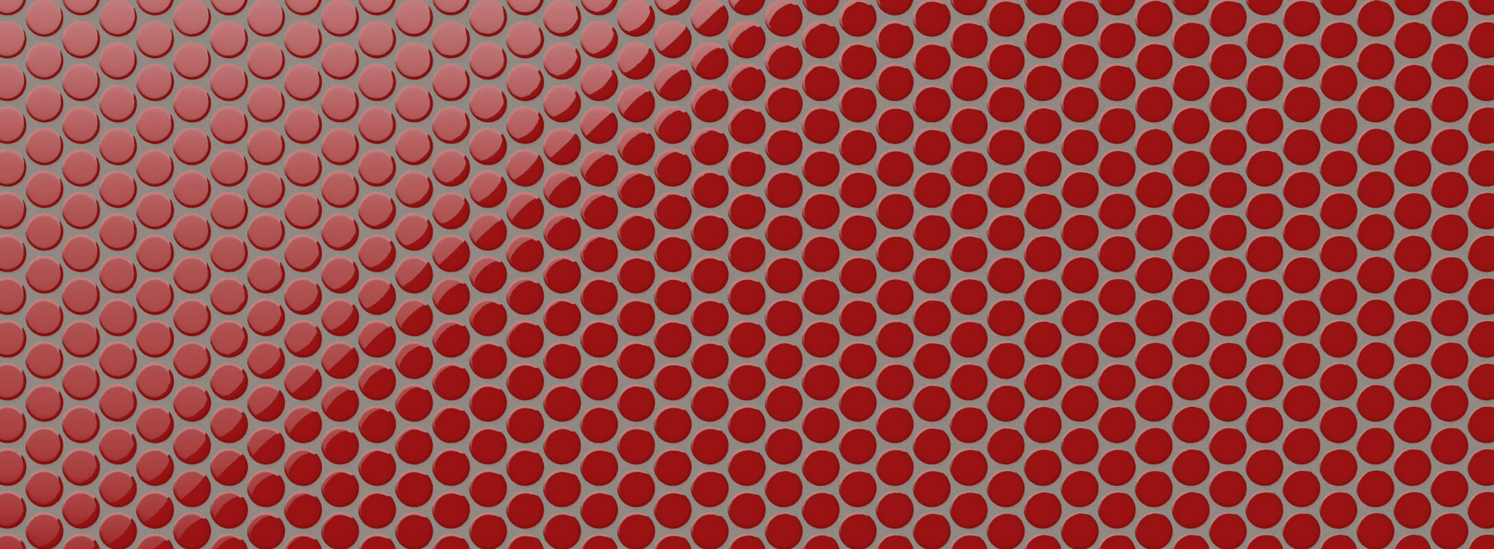 Glossy red penny tiles create a striking mosaic pattern on the shower wall, adding a vibrant pop of color to the bathroom