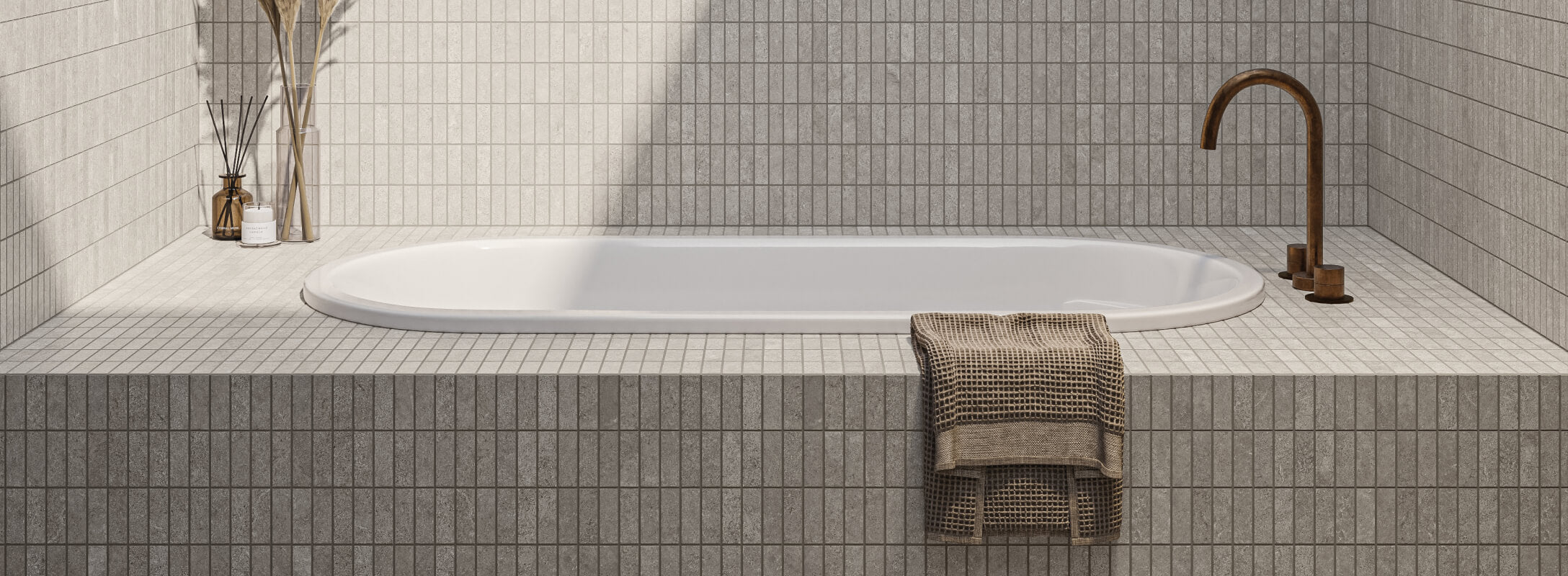 Sleek taupe wall tiles with subtle textures complement the modern minimalist bathroom, harmonized by a classic white tub and refined accessories