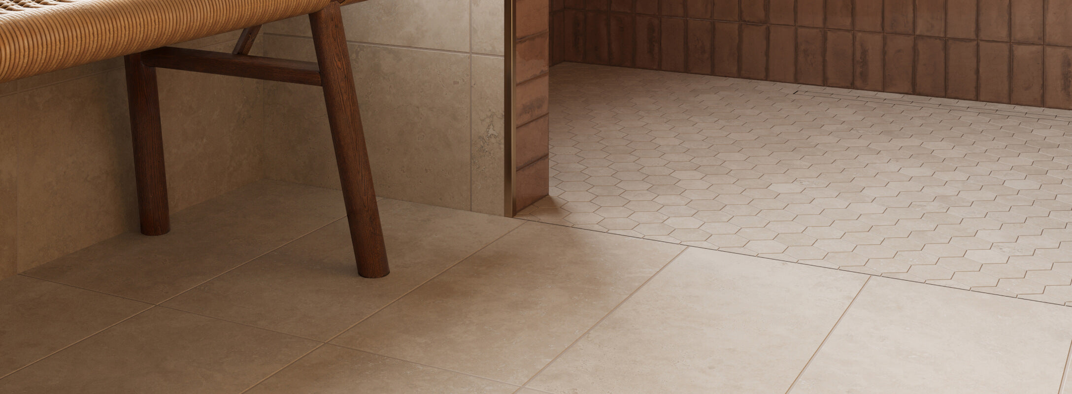 Warm beige floor tiles paired with hexagonal mosaics, creating a cozy and inviting space with a woven bench.