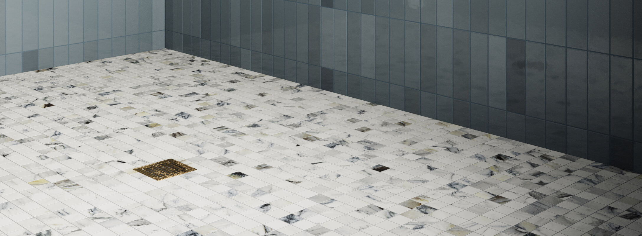 Matte white marble look mosaic tiles with grey and blue veining cover the floor, accentuated by glossy blue vertical subway tiles on the adjacent wall