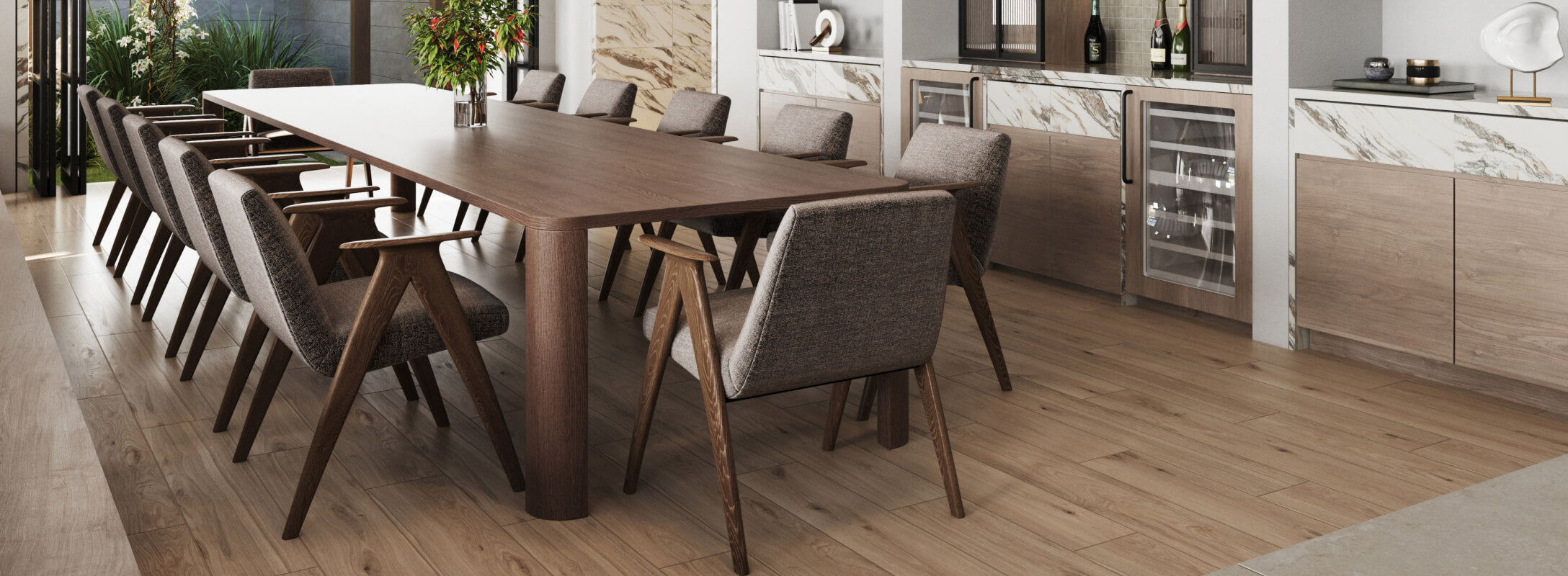 Modern dining room with warm brown wood flooring, a sleek wooden table, upholstered chairs, and a bar area with marble accents