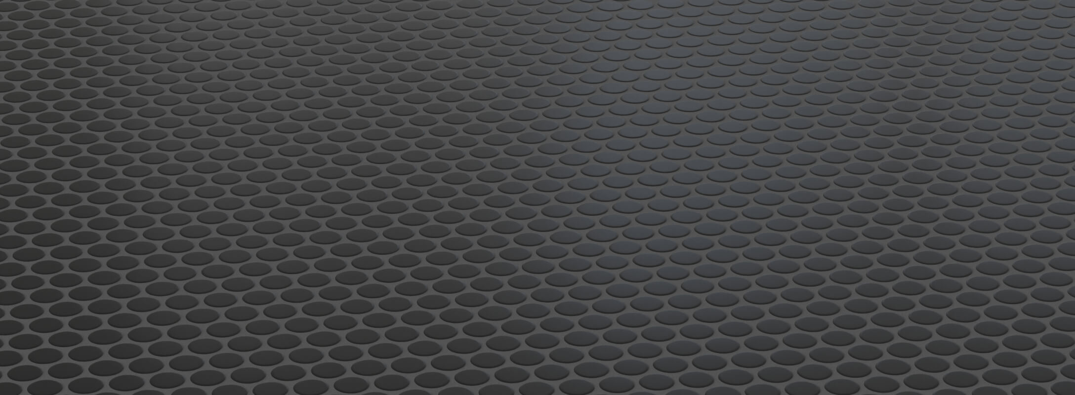 Sleek black mosaic floor tiles with a matte finish, arranged in a classic penny round pattern, perfect for modern kitchen spaces