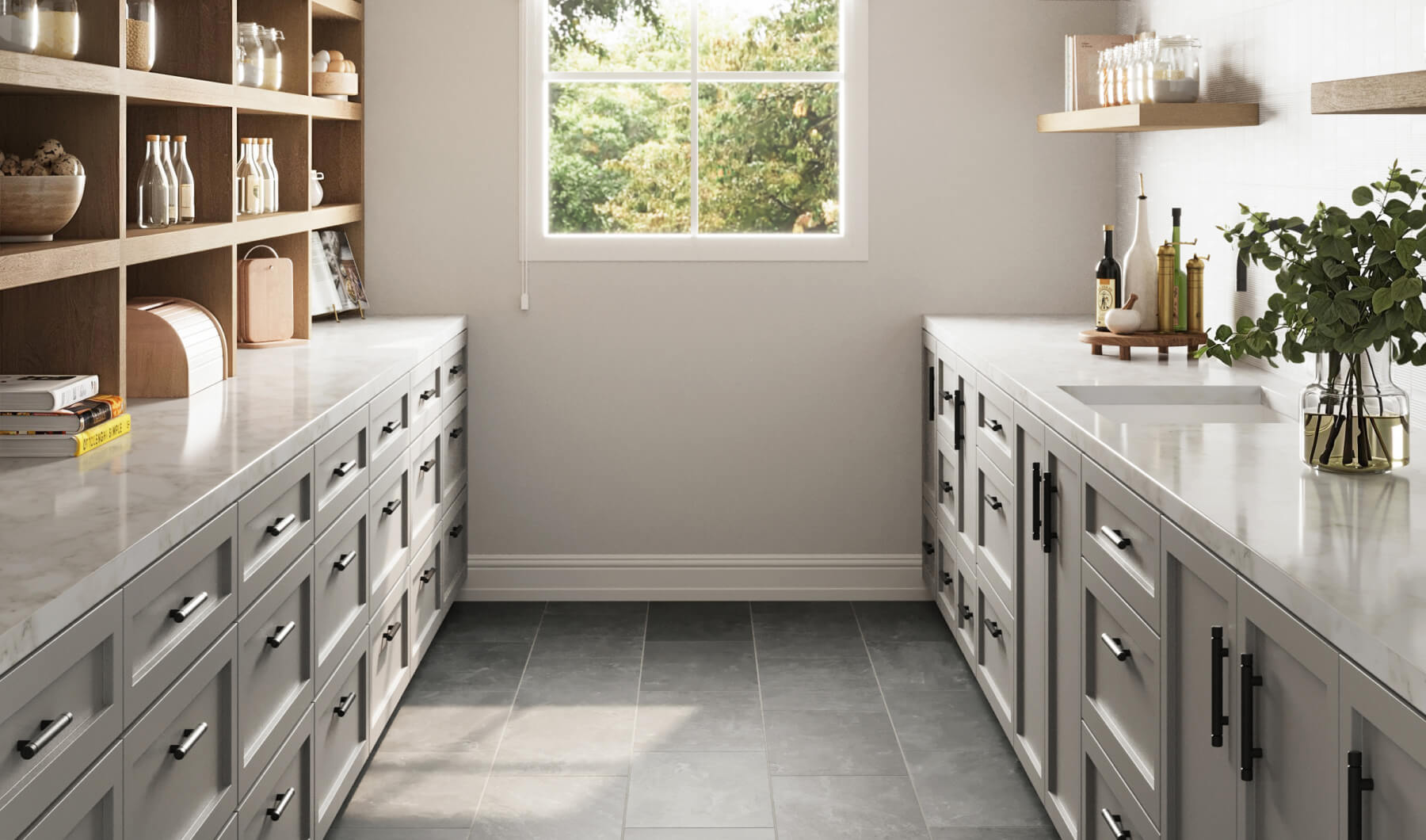 Dark grey floor tiles complement a bright pantry with white countertops, grey cabinets, and open wooden shelving, offering a modern and organized look