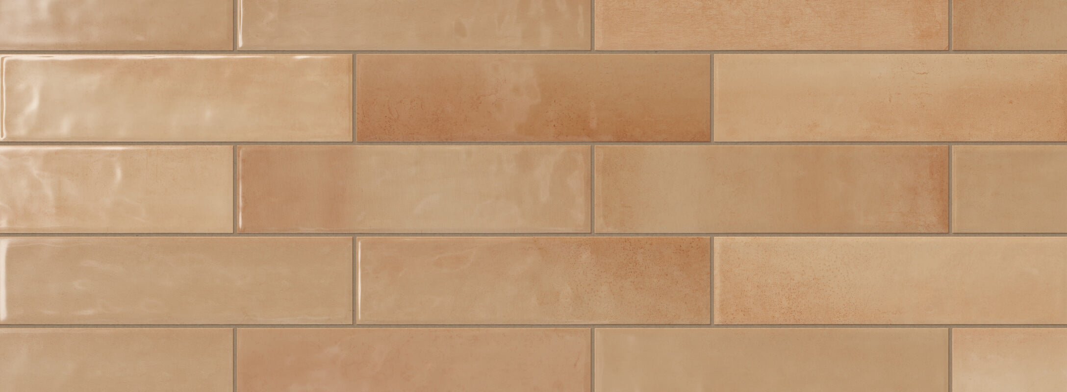Glossy orange subway tiles with a warm, earthy hue, creating a cozy and inviting kitchen backsplash