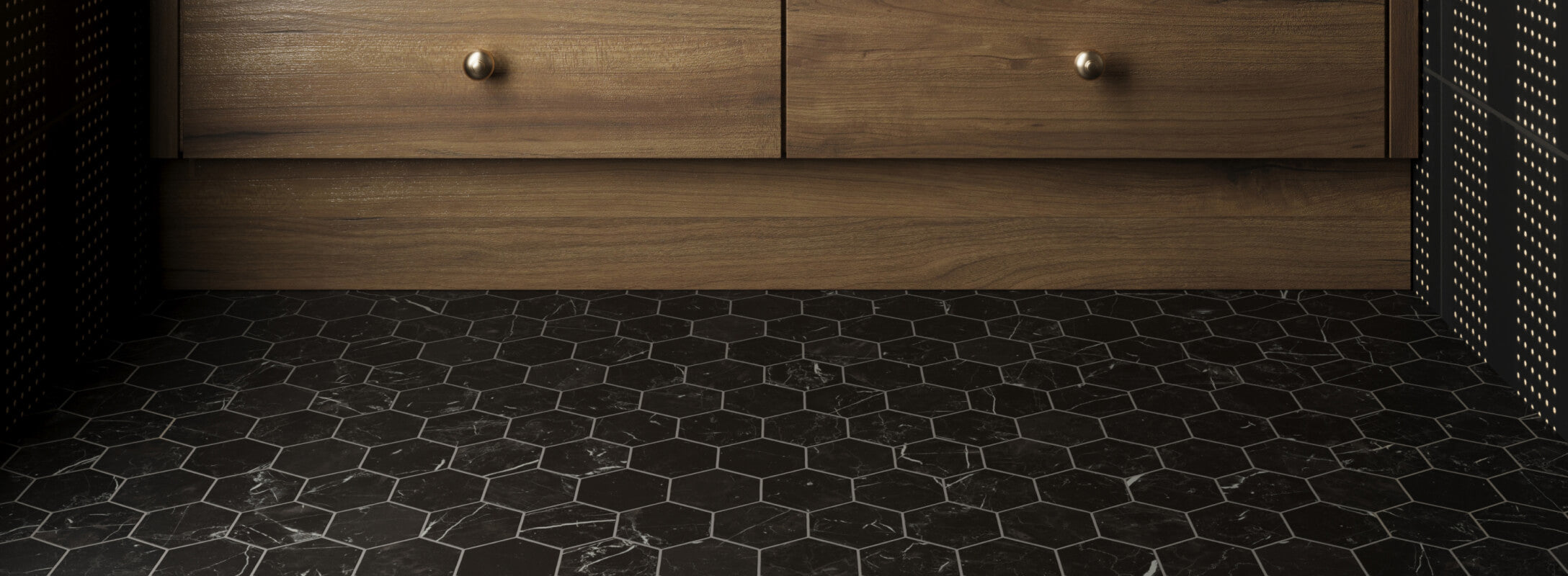 Matte black hexagonal mosaic floor tiles with subtle marbling paired with dark wood cabinetry, creating a sleek, modern aesthetic