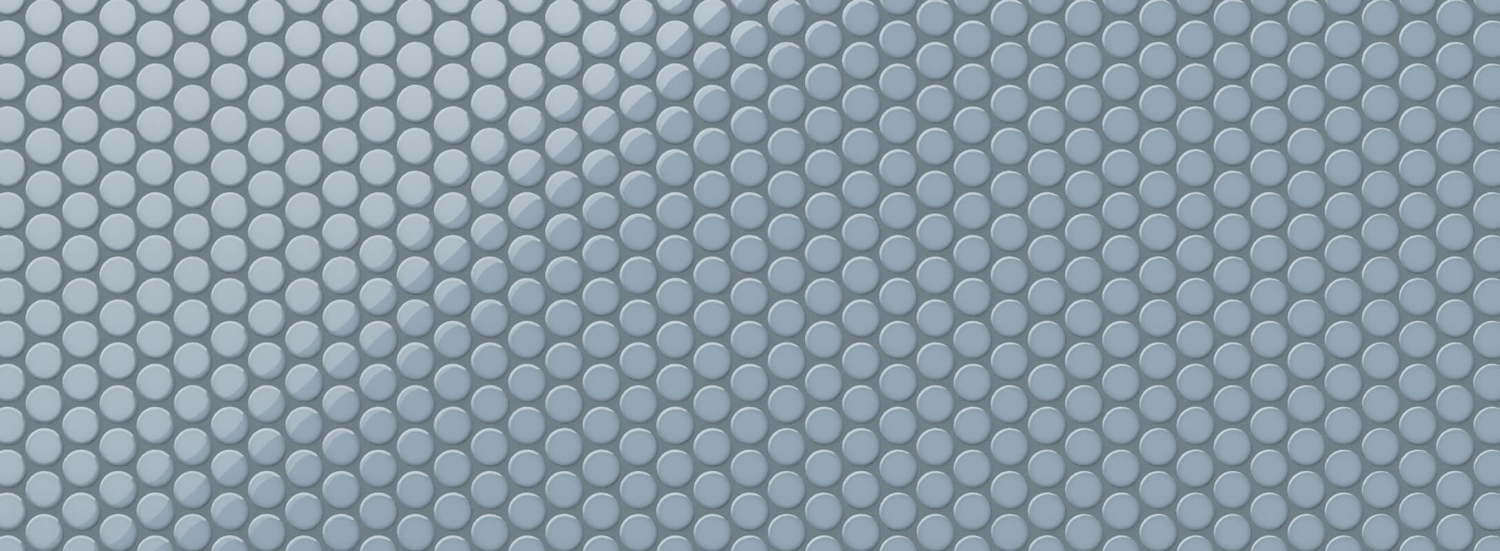 Glossy blue penny tiles arranged in a mosaic pattern, bringing a playful yet sophisticated texture to any space