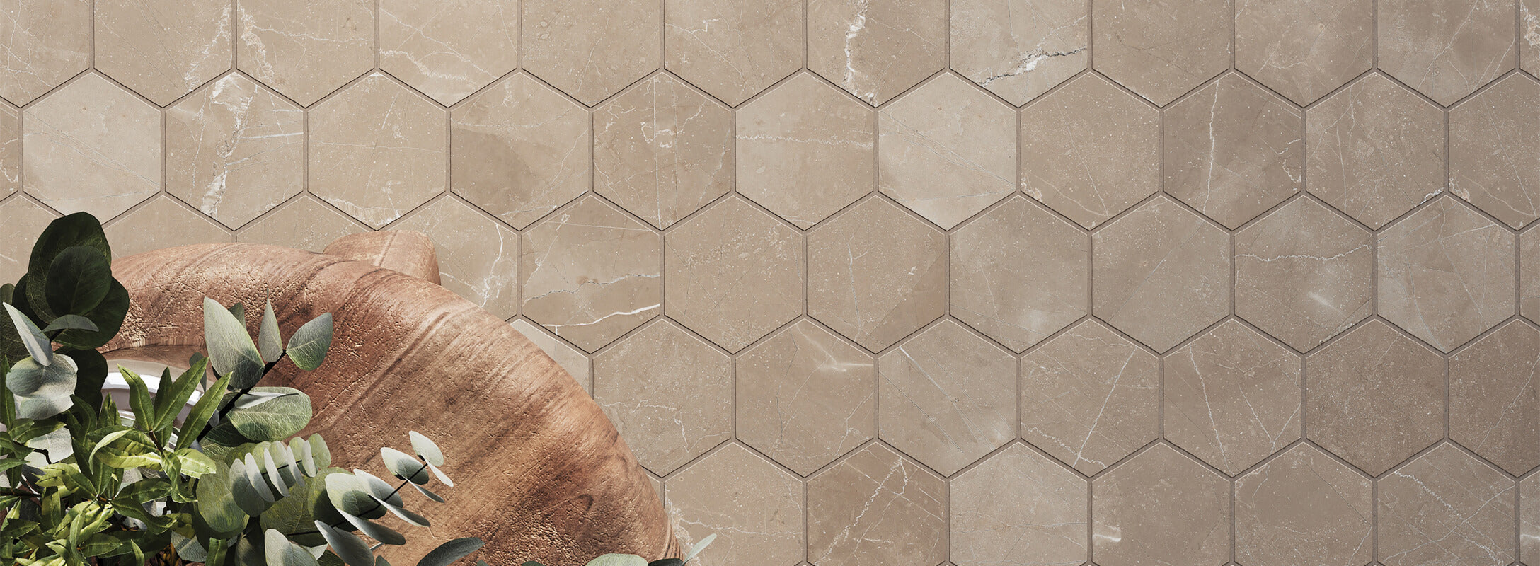 Elegant brown hexagonal tiles with subtle marble-like veining create a natural, textured surface, complemented by a rustic wooden planter filled with greenery