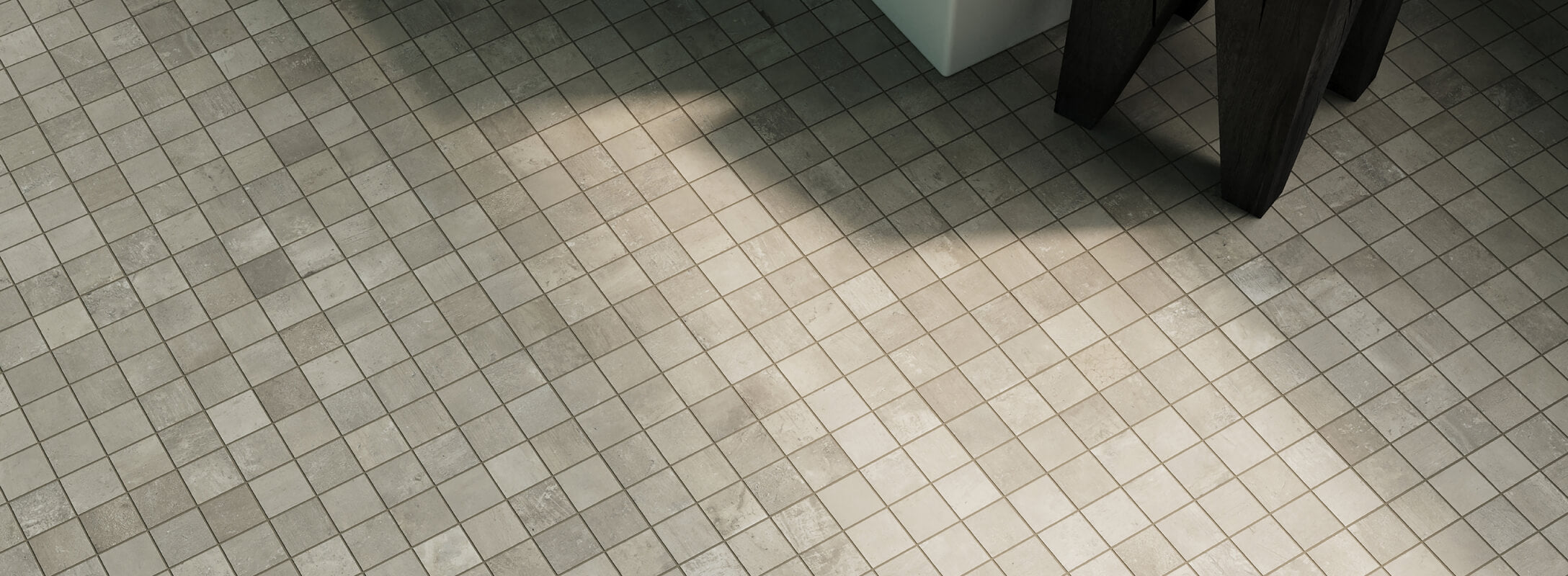 Taupe mosaic tiles create a harmonious grid with soft natural tones, ideal for modern, minimalist spaces.