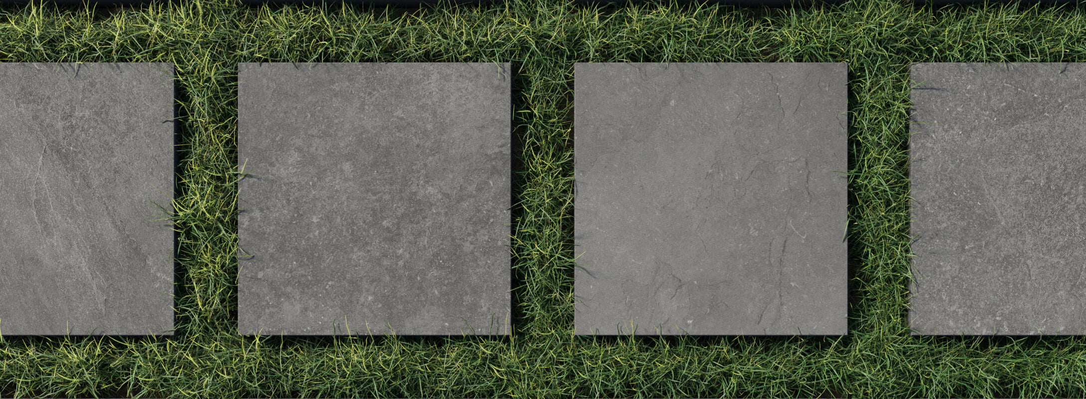 Dark grey paver tiles set in lush green grass create a striking modern pathway, combining natural textures with sleek design.