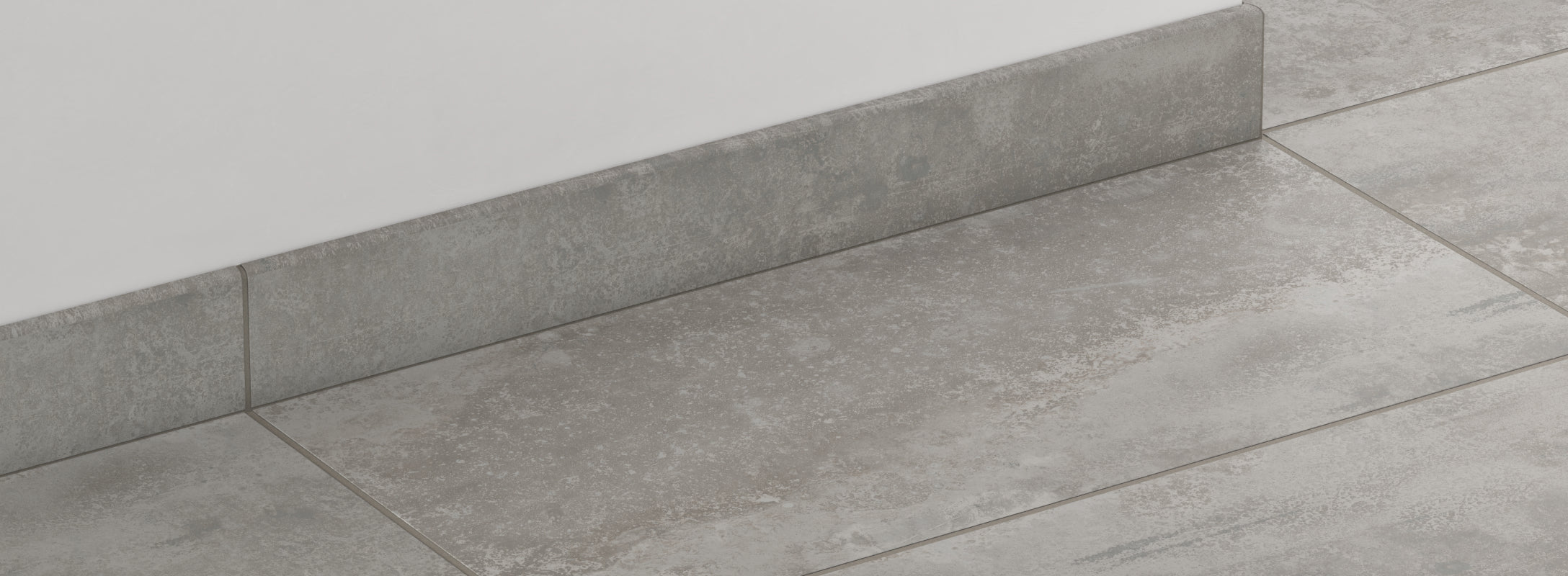 Matte gray stone look tiles with matching edge trim, offering a sleek and contemporary finish with natural texture.
