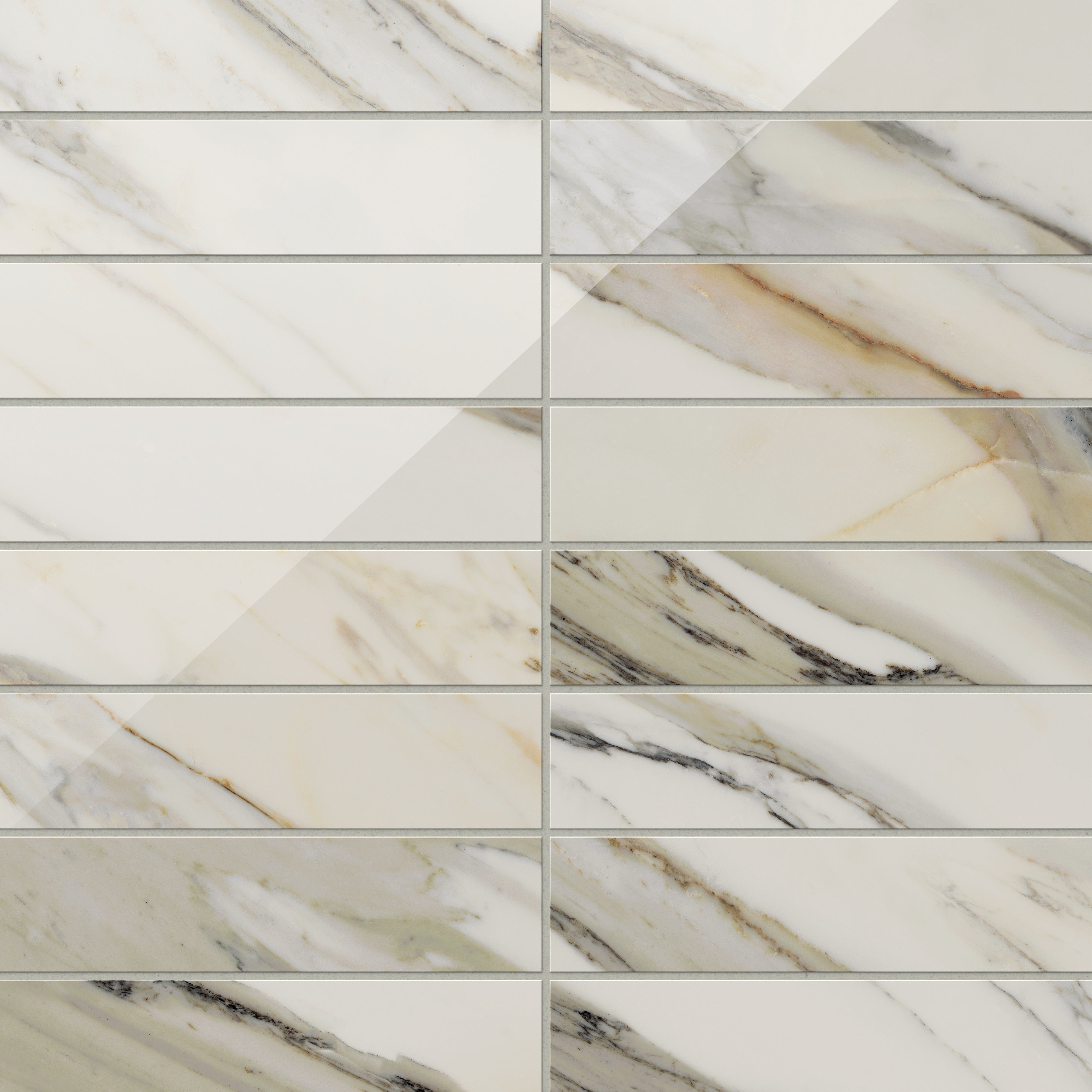 Calacatta Cremo polished marble look tiles in 3x12, displaying elegant white tones accented with beige and taupe veins for a timeless appeal.