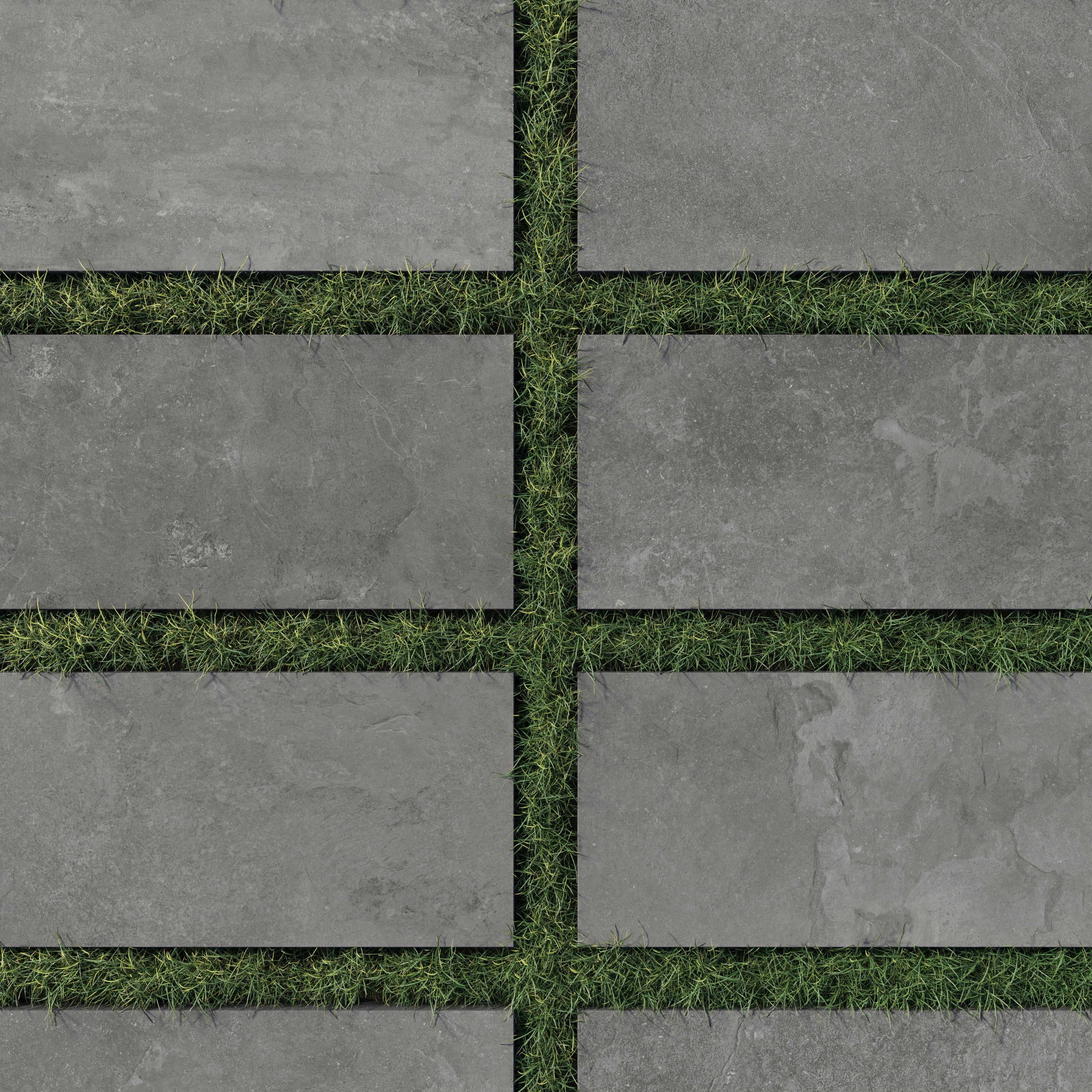 Modern 12x24 porcelain pavers in dark gray tones with a 2cm outdoor grip matte finish, neatly arranged over lush green grass for a sleek outdoor look.