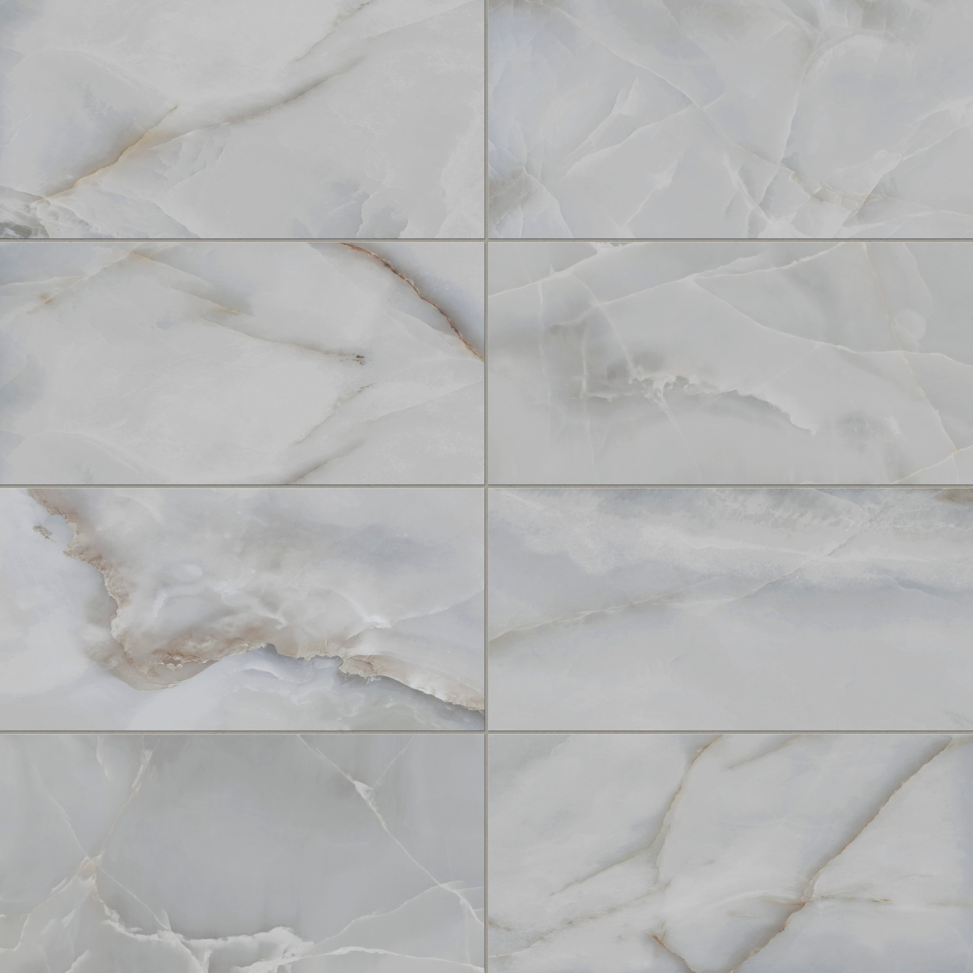 Astrid 12x24 matte porcelain tile in Slate, showcasing soft slate blue tones with subtle white and golden veining for a sophisticated marble-like finish.