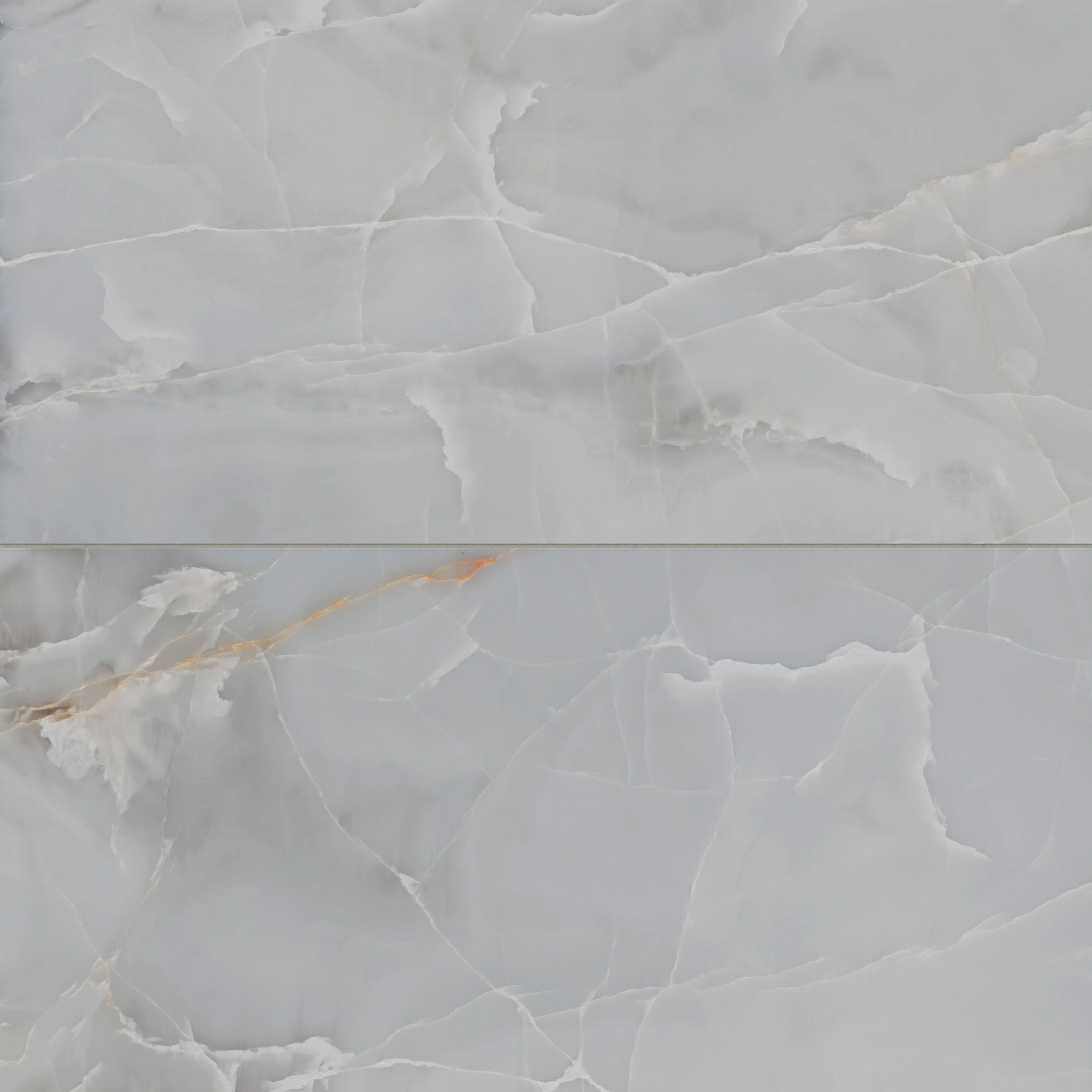 Astrid 24x48 matte porcelain tile in slate, showcasing cool gray hues with soft white veining and subtle golden accents for a sophisticated stone-like look.