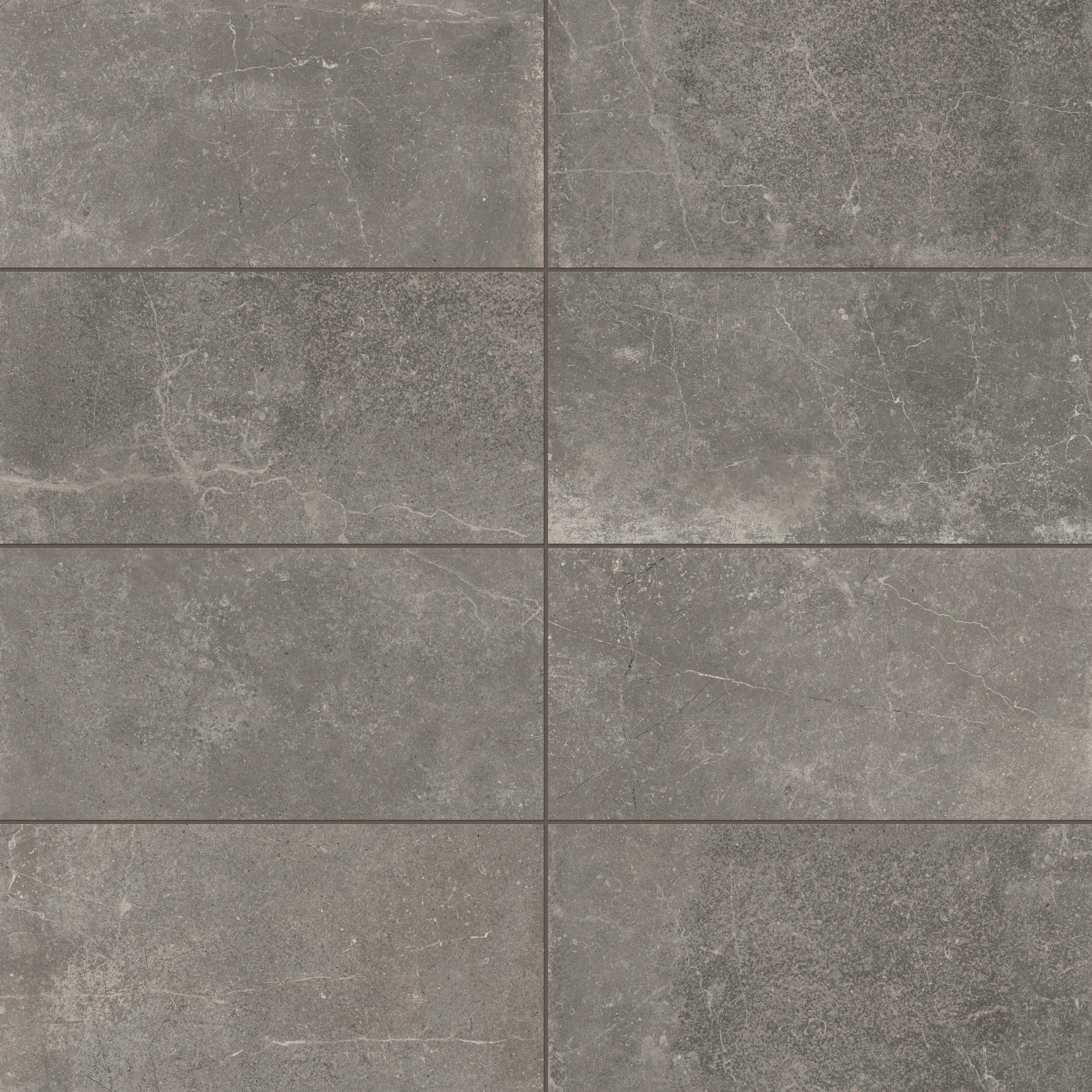 Rich 12x24 matte porcelain tiles in deep smoky gray tones, highlighted with natural veining for a bold and contemporary design.