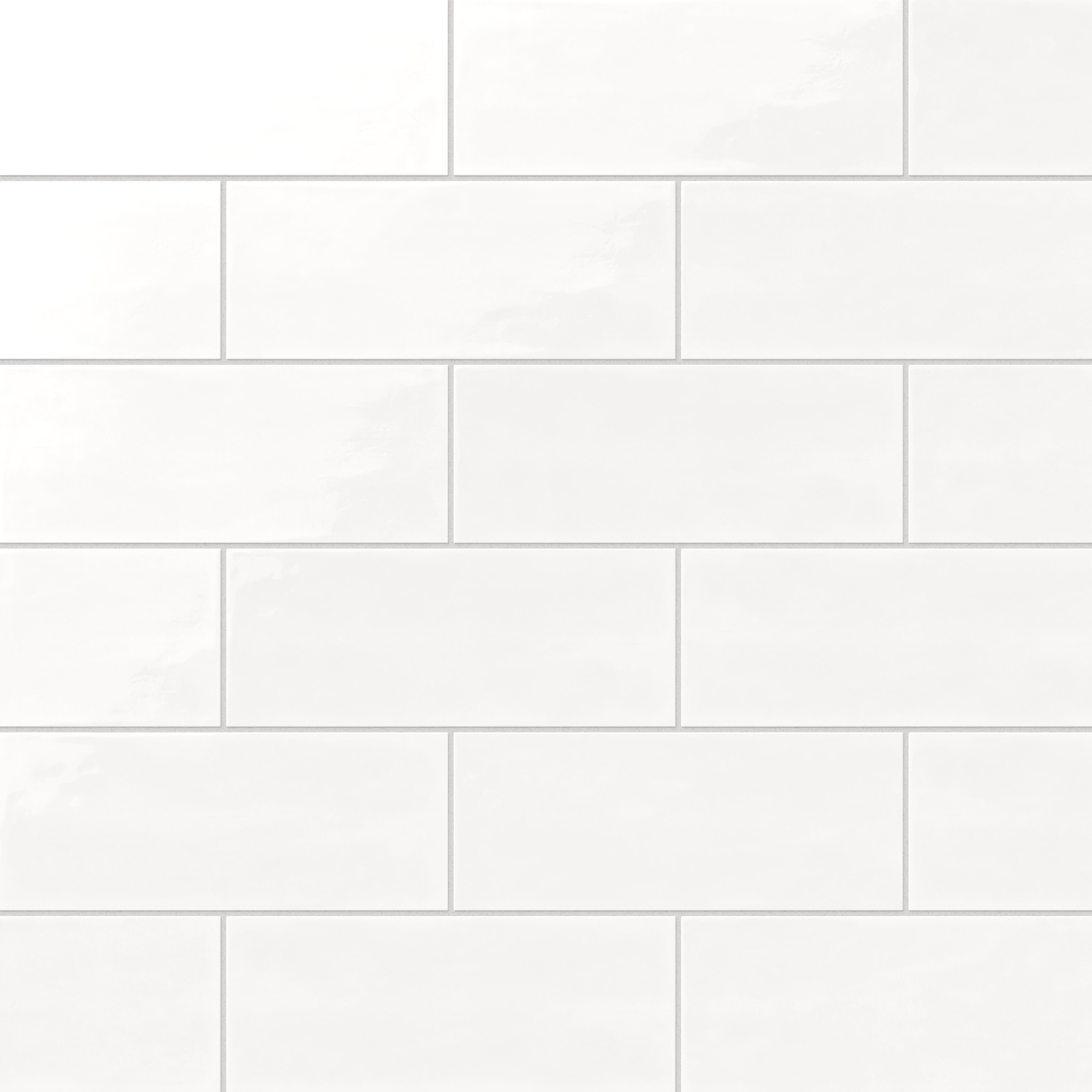 Soft pearl white 4x10-inch glossy ceramic tiles arranged in a clean subway pattern for a sleek, timeless aesthetic