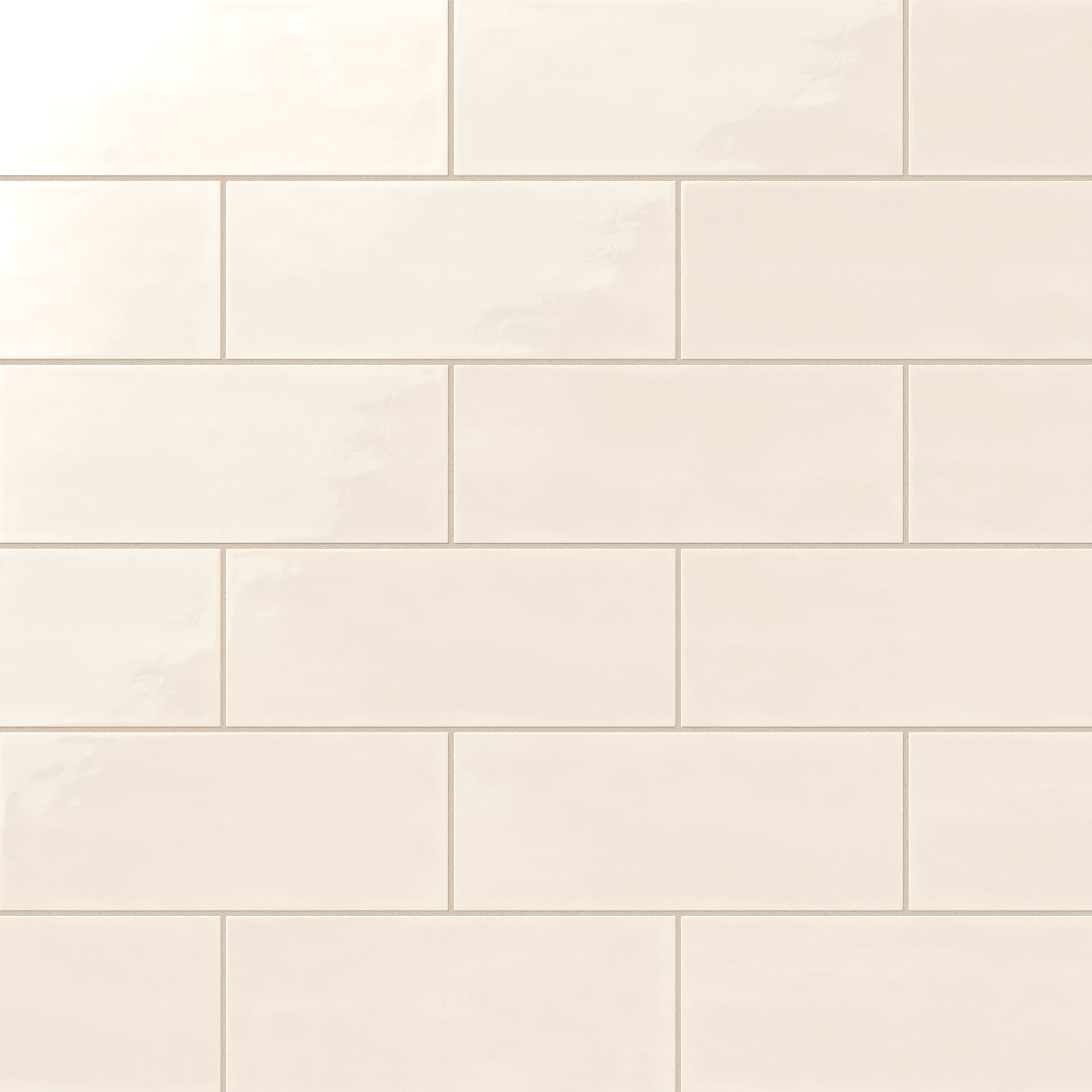 Soft cream 4x10-inch ceramic subway tiles with a glossy finish, arranged in a staggered brick pattern