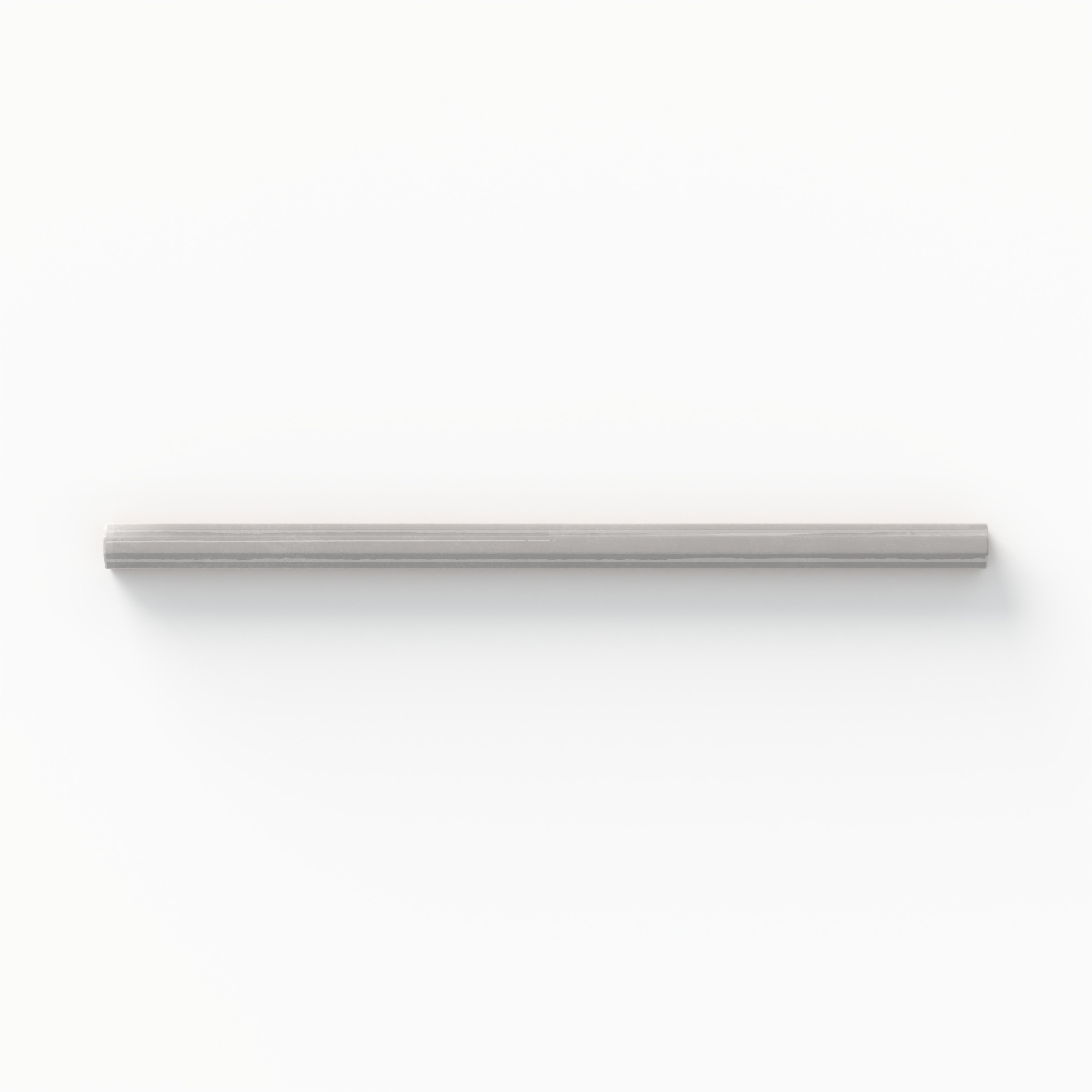 Refined fog gray pencil liner tile with a glossy finish, perfect for adding subtle elegance to walls and backsplashes