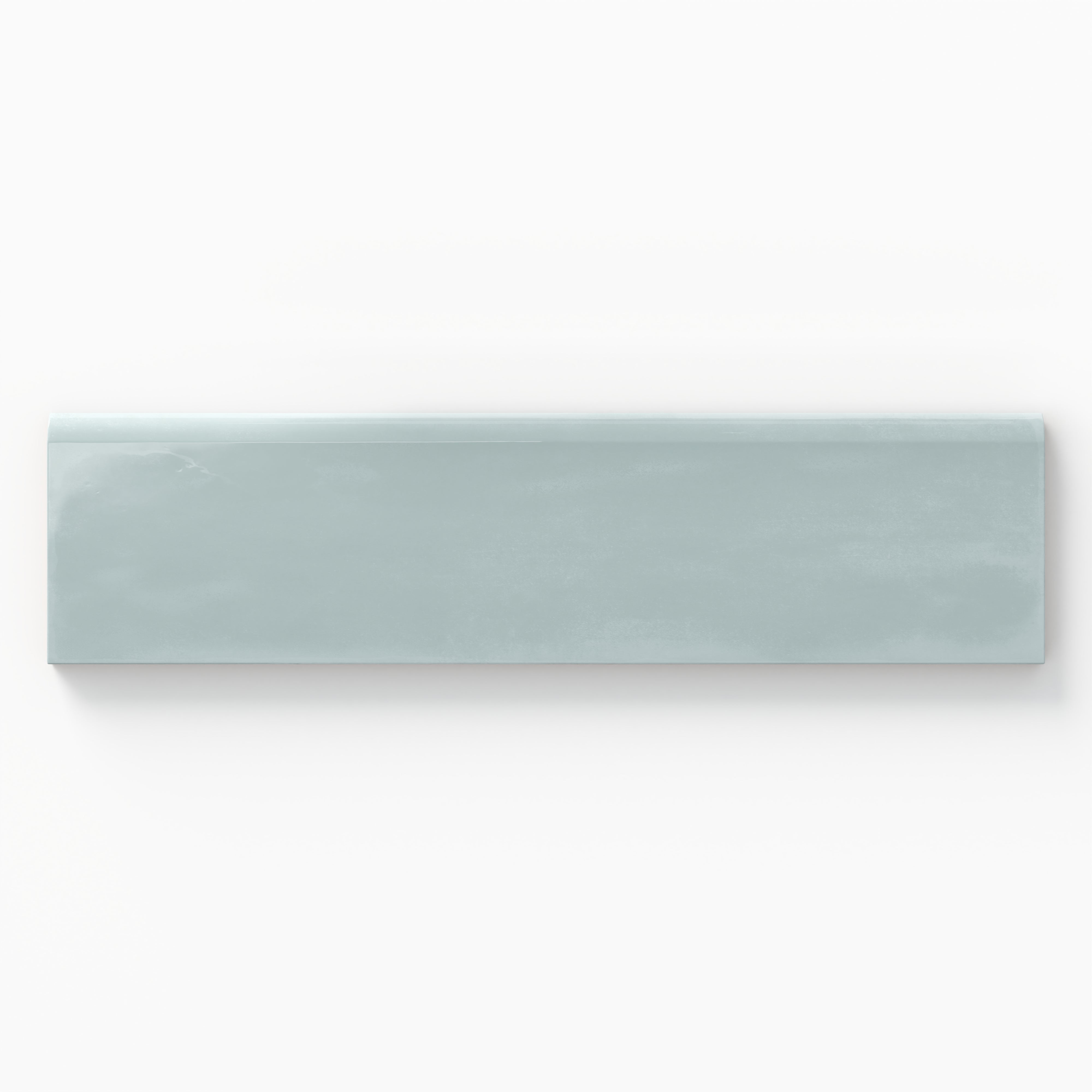Glossy 3x10 bullnose tile in a serene pale blue, perfect for soft, calming transitions in contemporary interiors