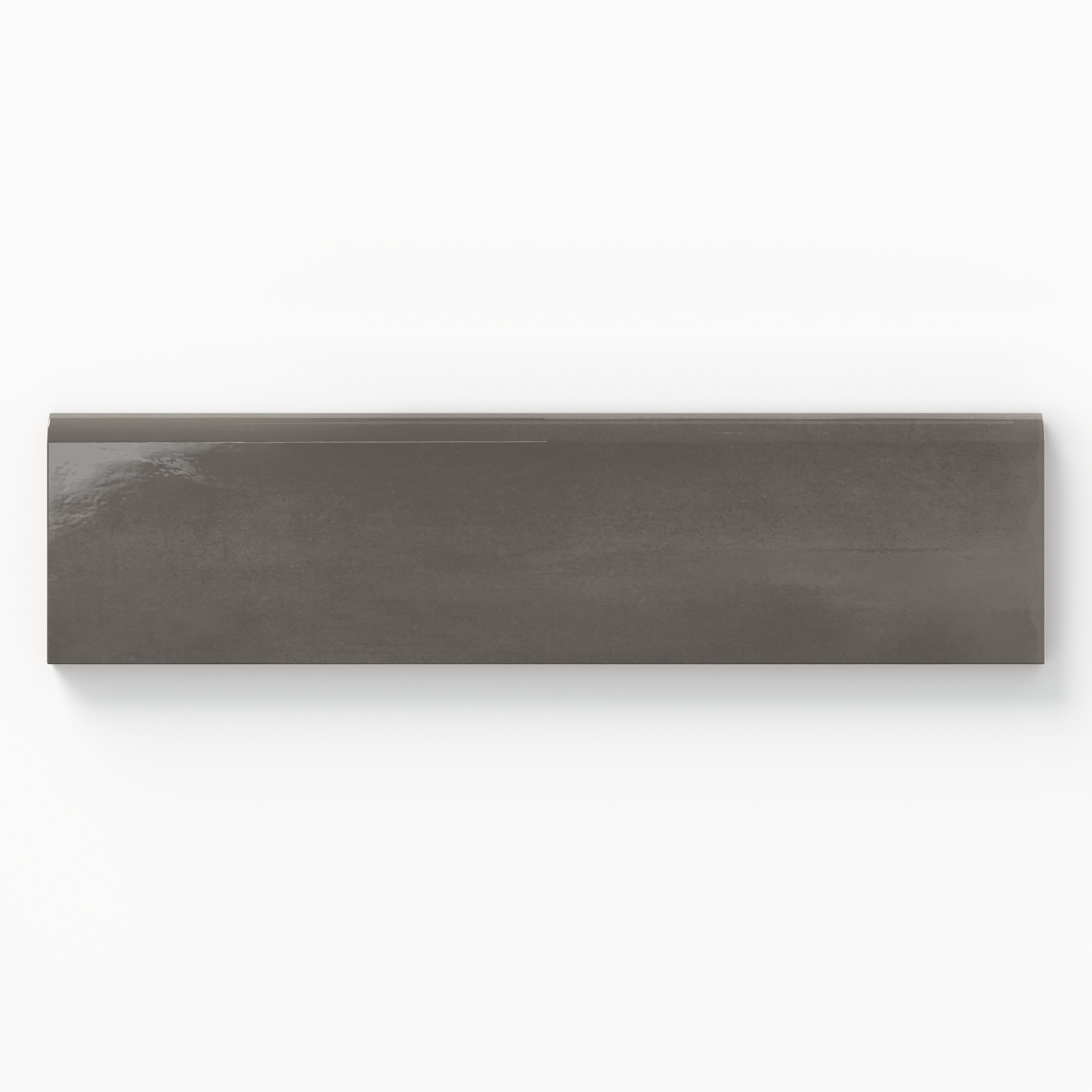 Glossy 3x10 bullnose tile in a deep charcoal gray, offering sleek sophistication for modern design accents