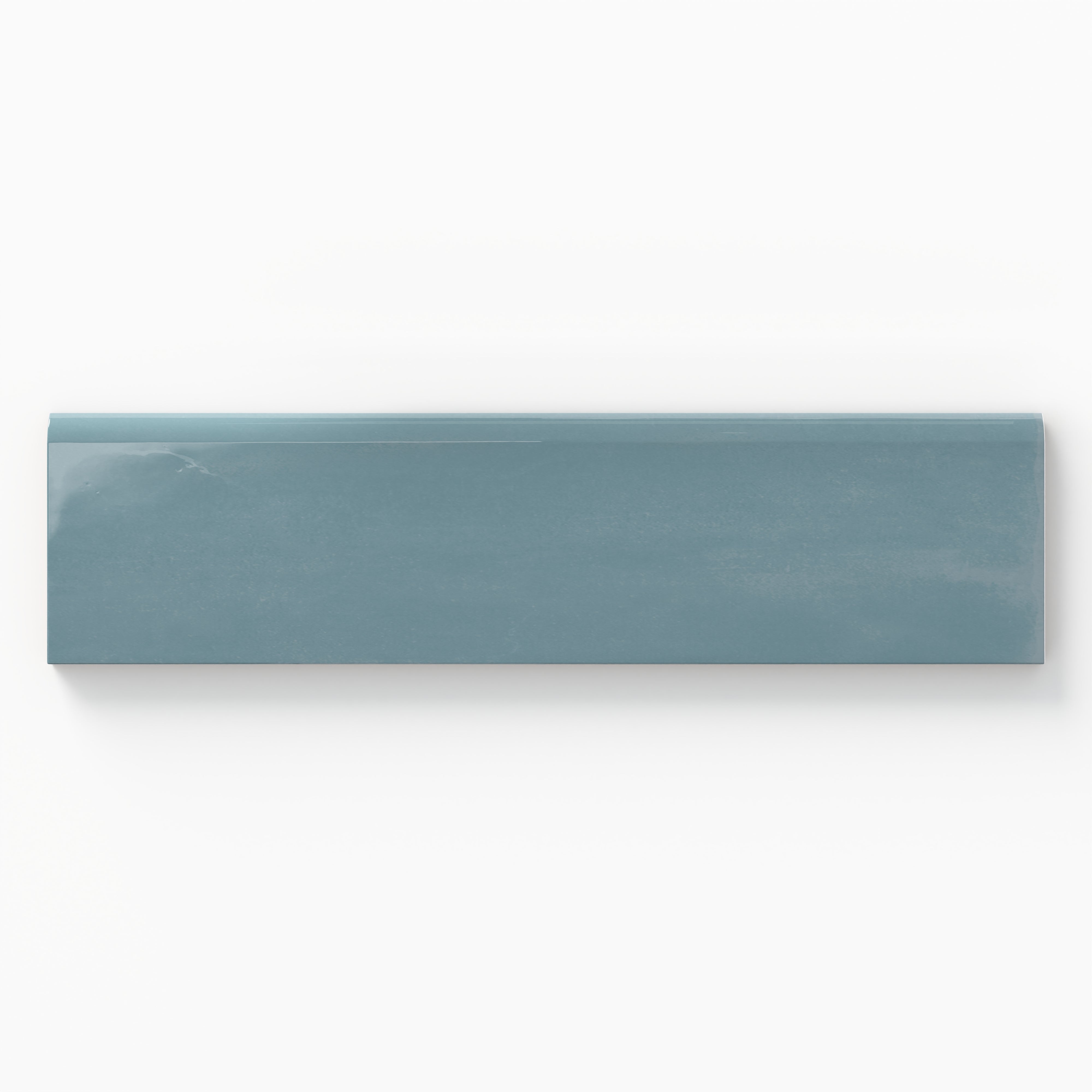 Glossy 3x10 bullnose tile in a deep bluish-teal tone, perfect for elegant transitions in coastal-inspired designs