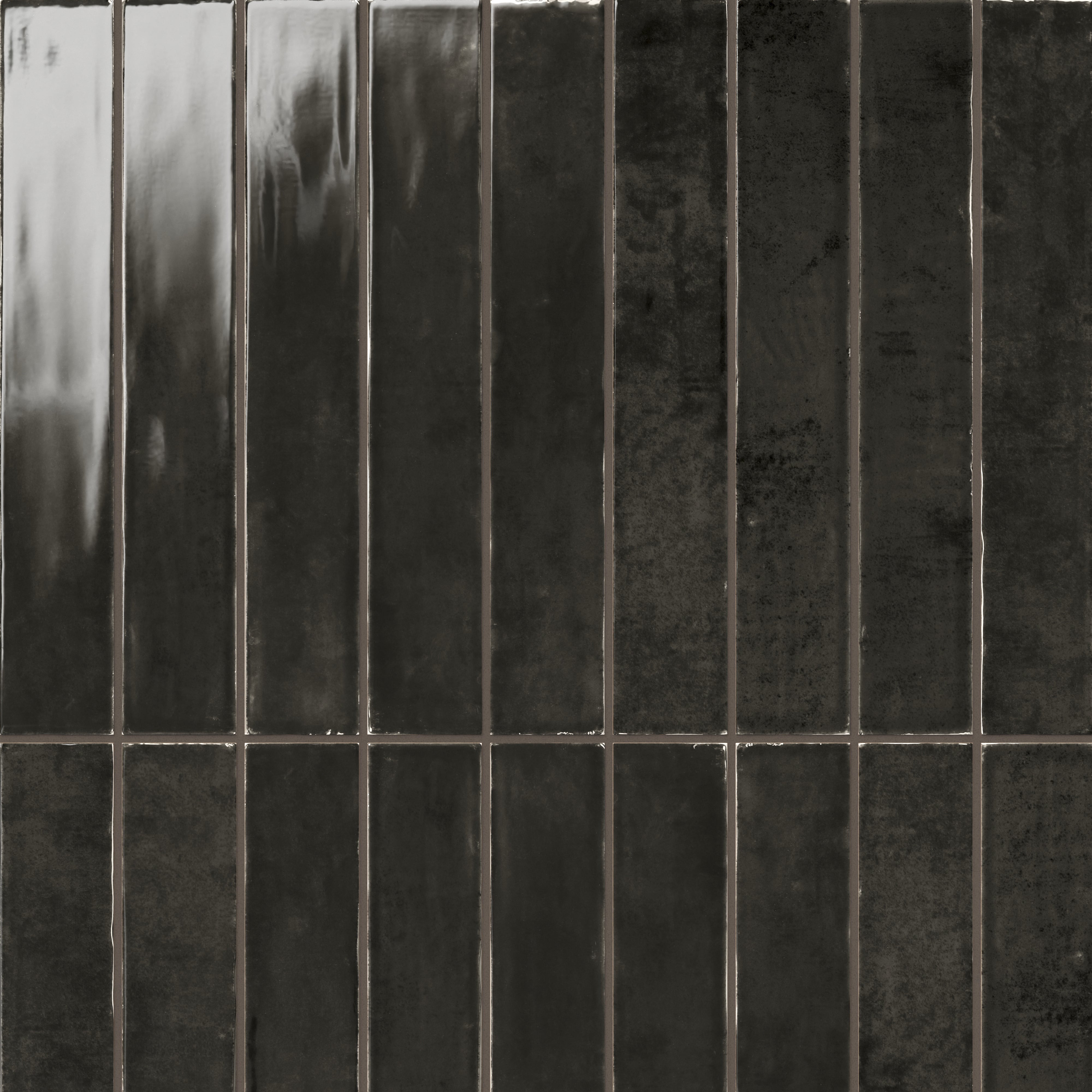 Deep charcoal gloss tile in a sleek 2.5x16 size, offering a polished, modern aesthetic with subtle texture for versatile wall designs.