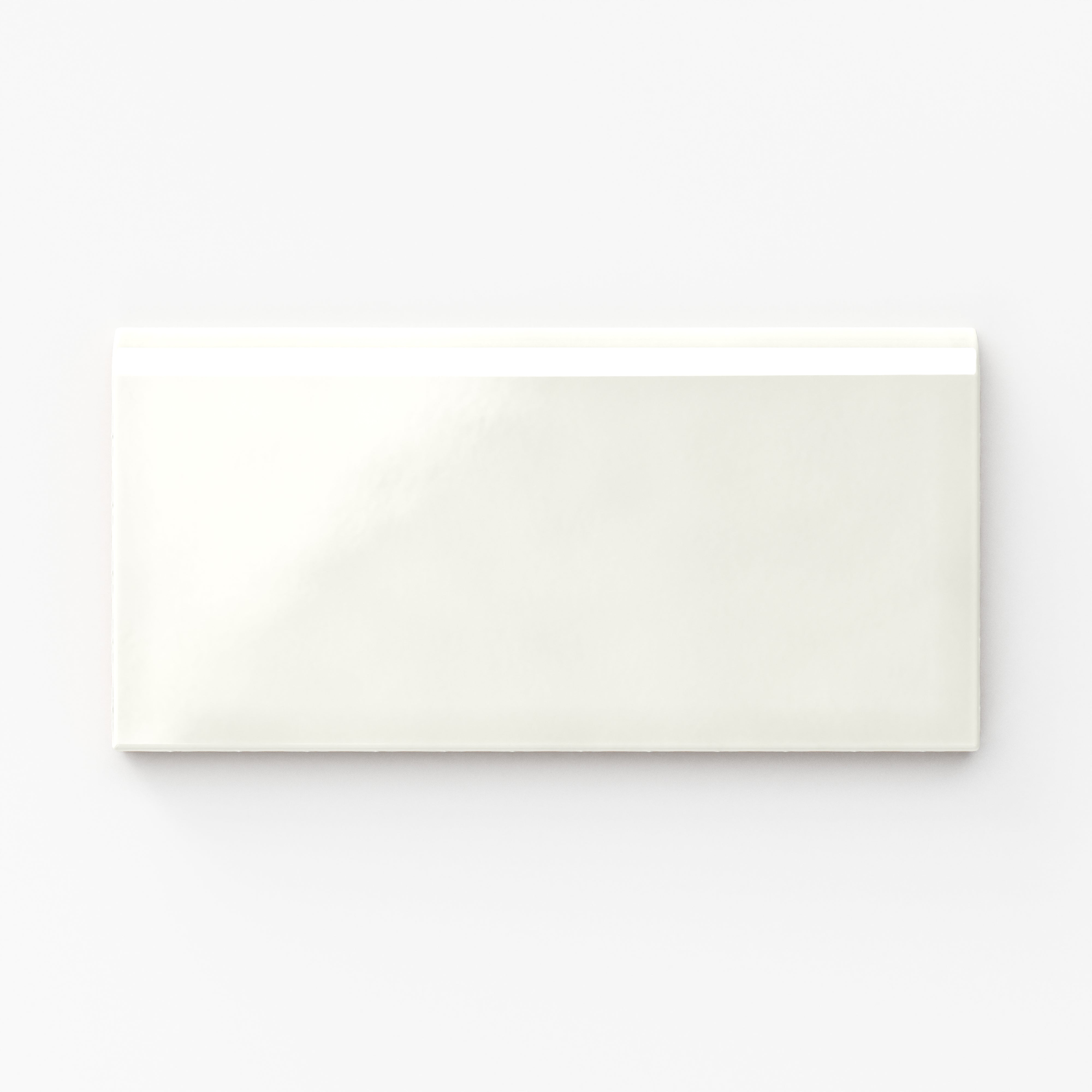 Glossy Mikayla ceramic bullnose tile in a soft off-white shade, perfect for clean, seamless finishing on edges and trims
