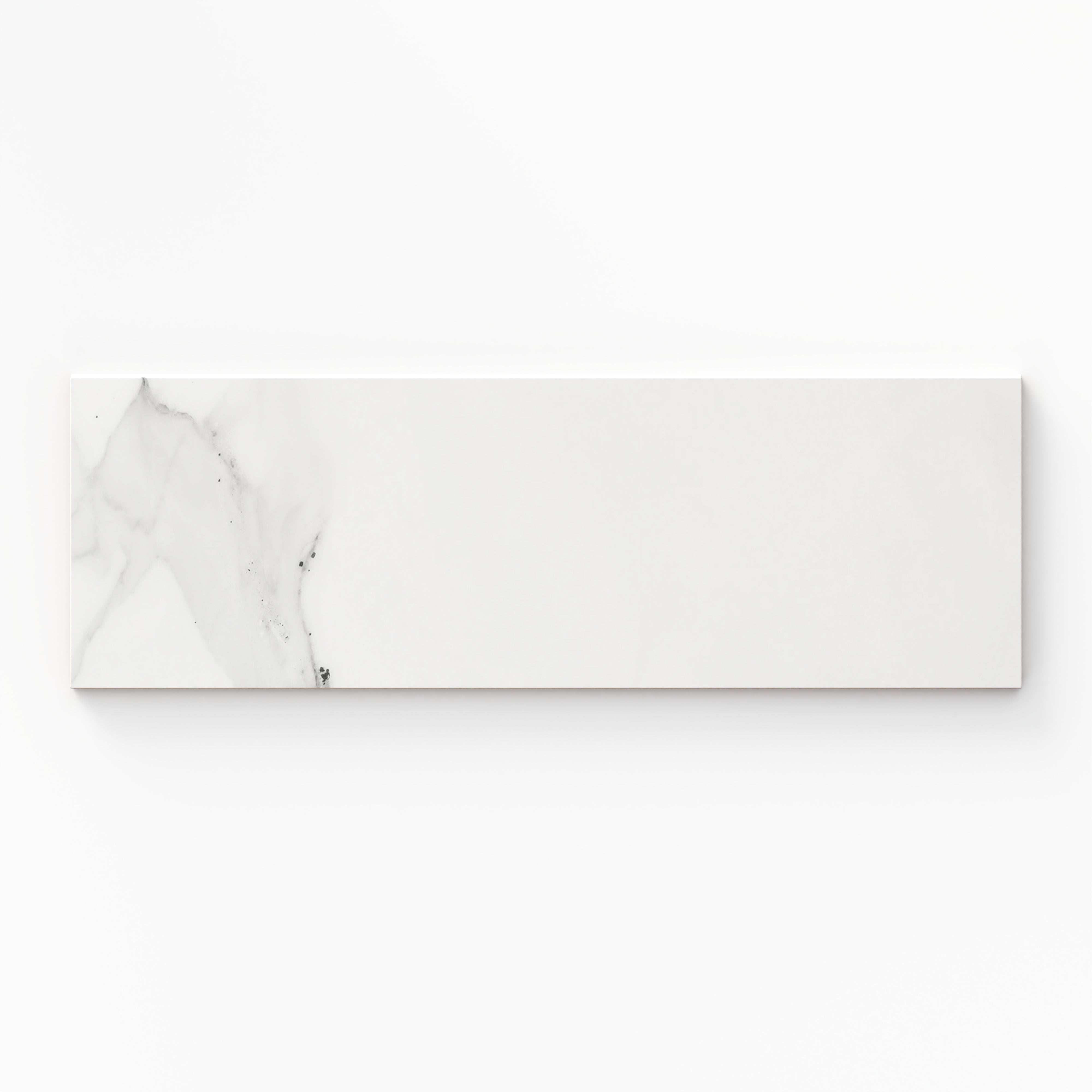 Julianna Carrara gloss bullnose tile in a 4x12 size, showcasing soft gray veining and a polished finish for refined edging.