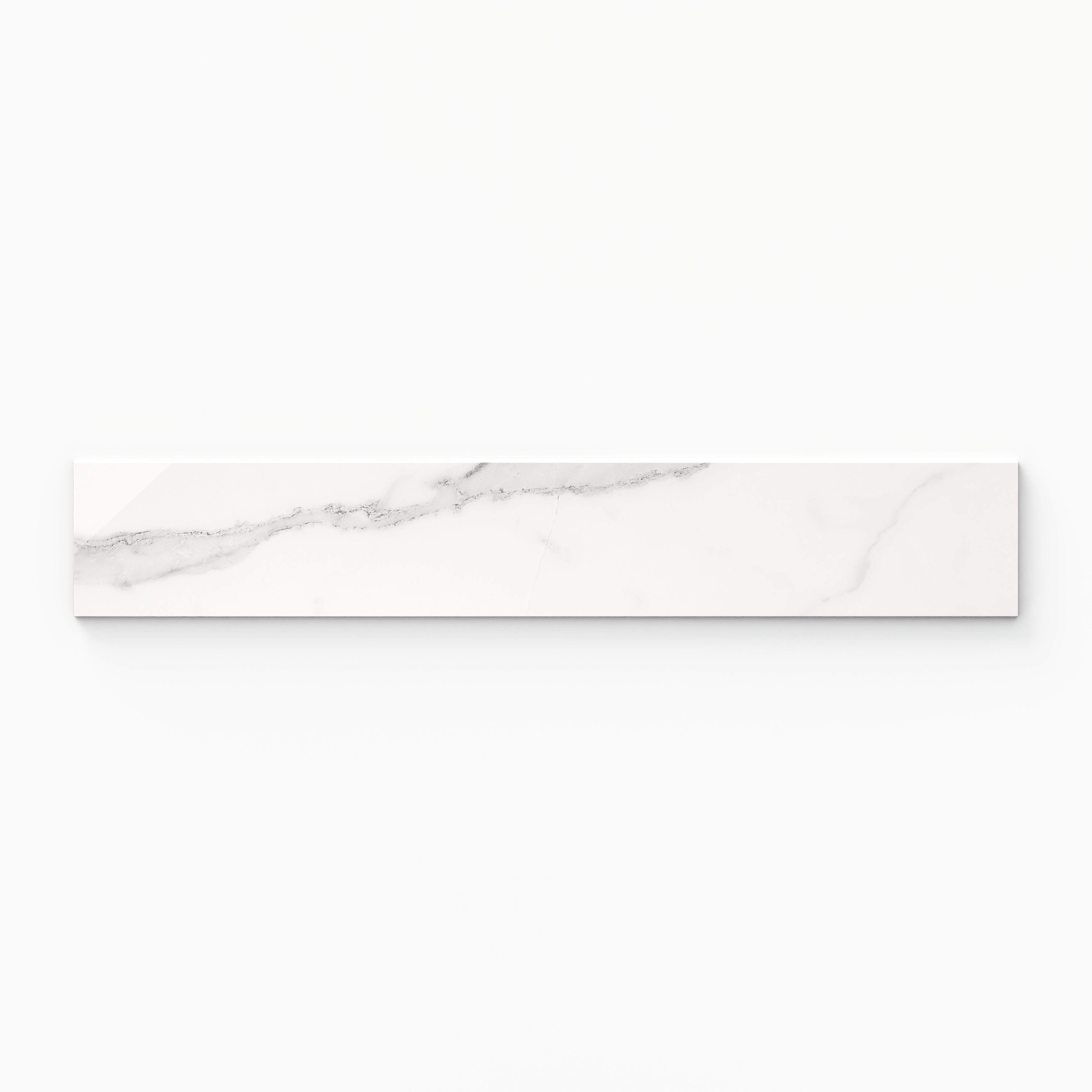 Elegant 4x24 polished bullnose tile in Julianna Carrara marble design, featuring soft gray veining on a white background.