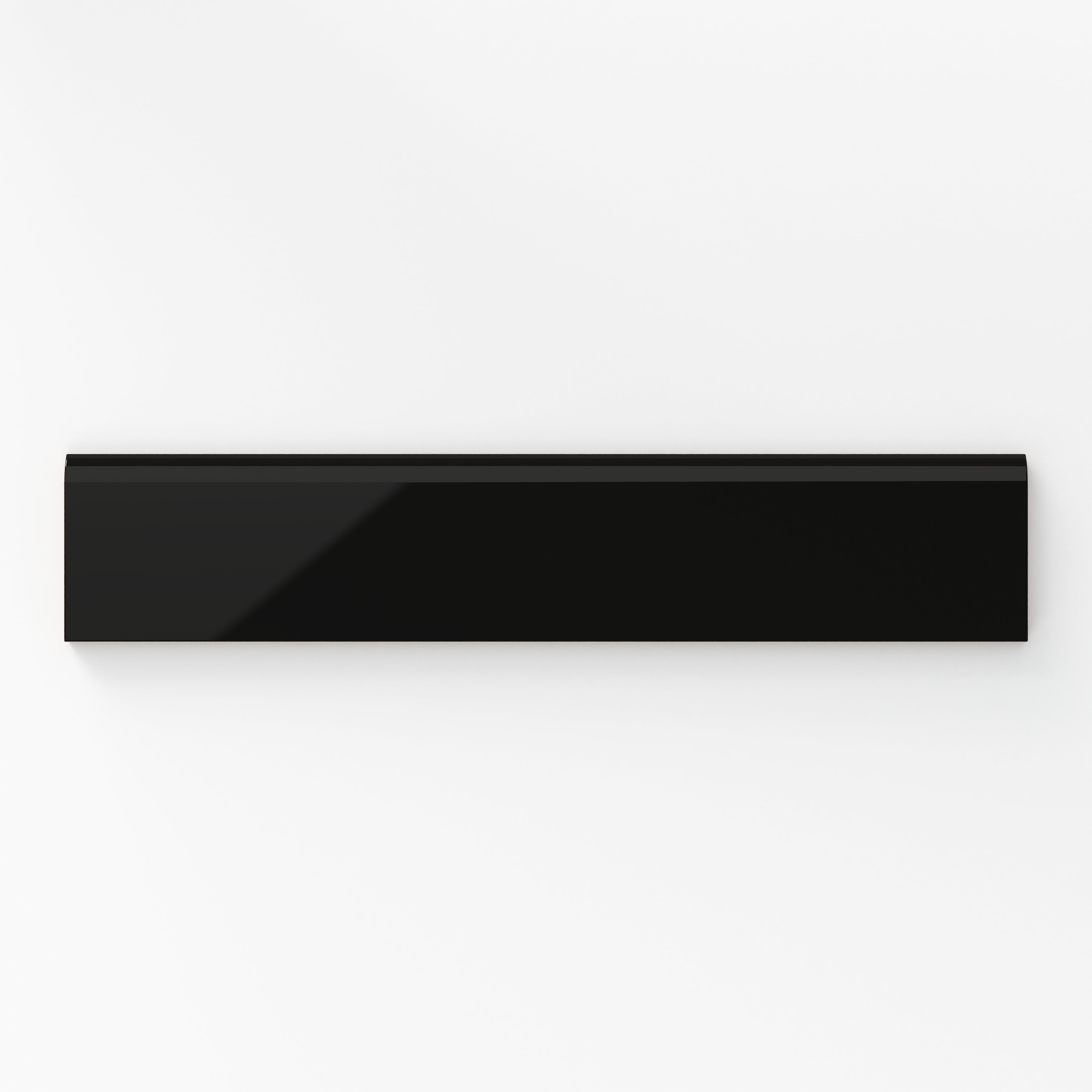 Glossy black bullnose tile in a deep midnight shade, offering a sleek and dramatic finish for modern interiors.