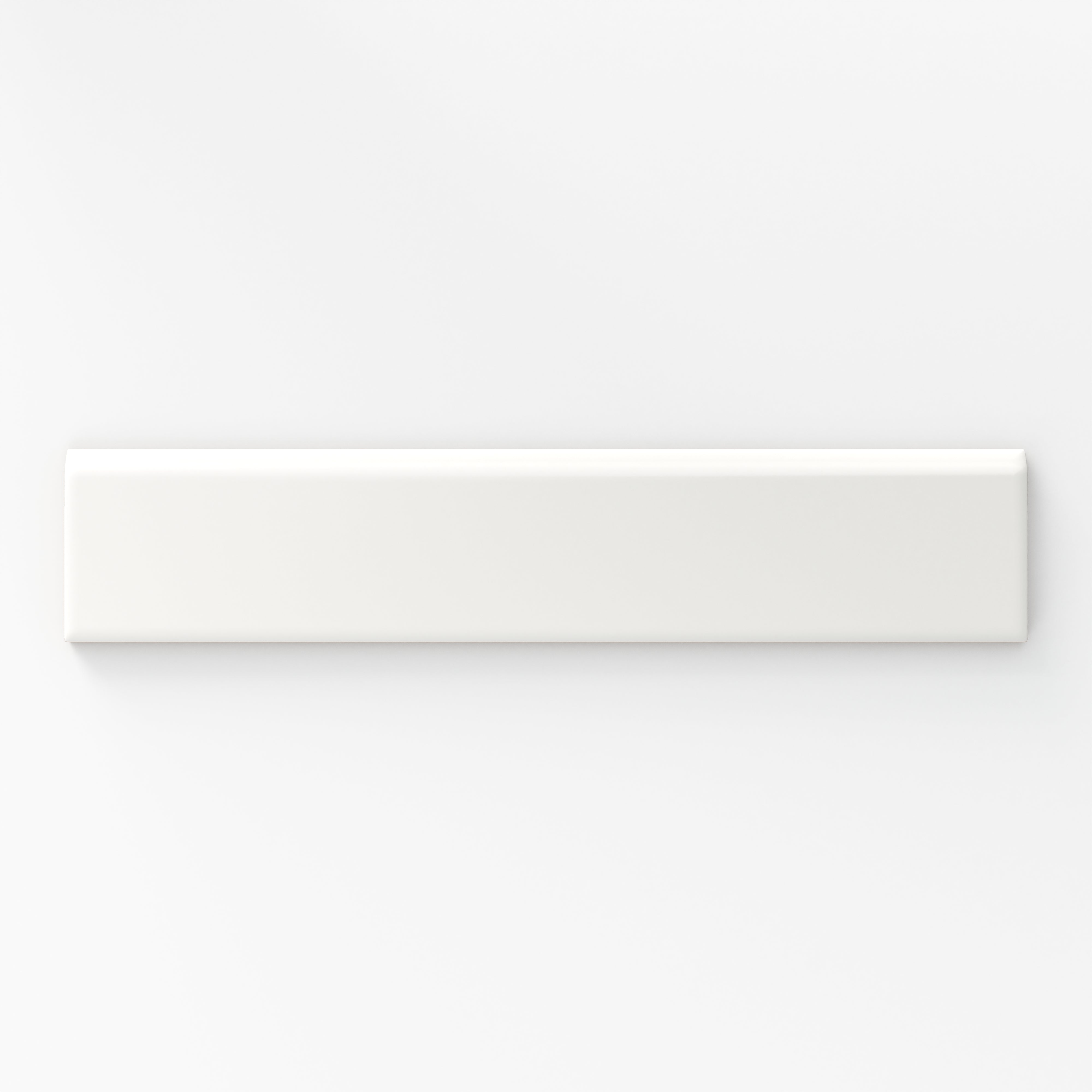 Matte white bullnose tile in a soft cloud shade, perfect for adding a smooth and refined edge to classic or modern designs.