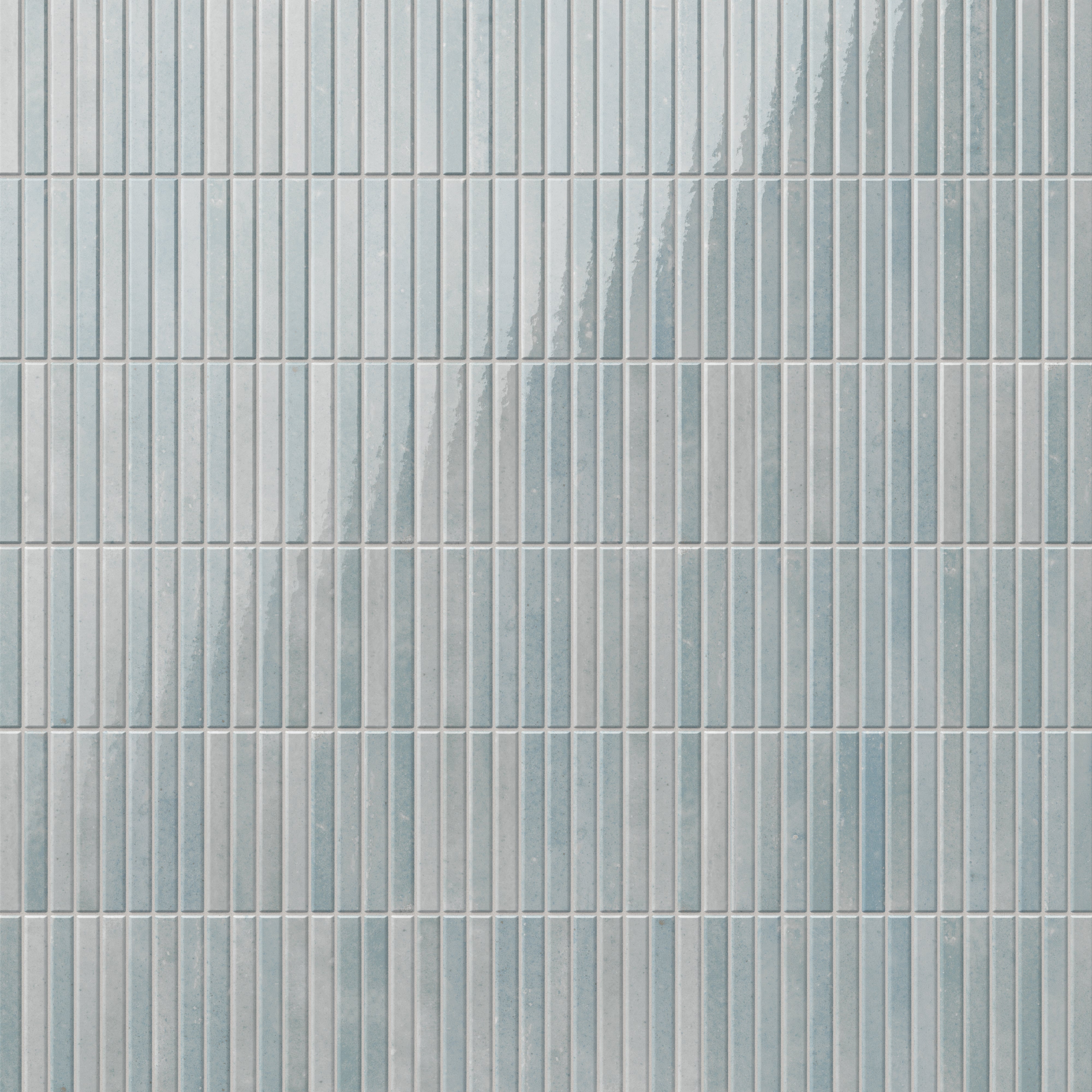Elegant Miley porcelain tiles with subtle blue and light gray hues and a glossy finish, featuring vertical grooves for a modern and textured aesthetic