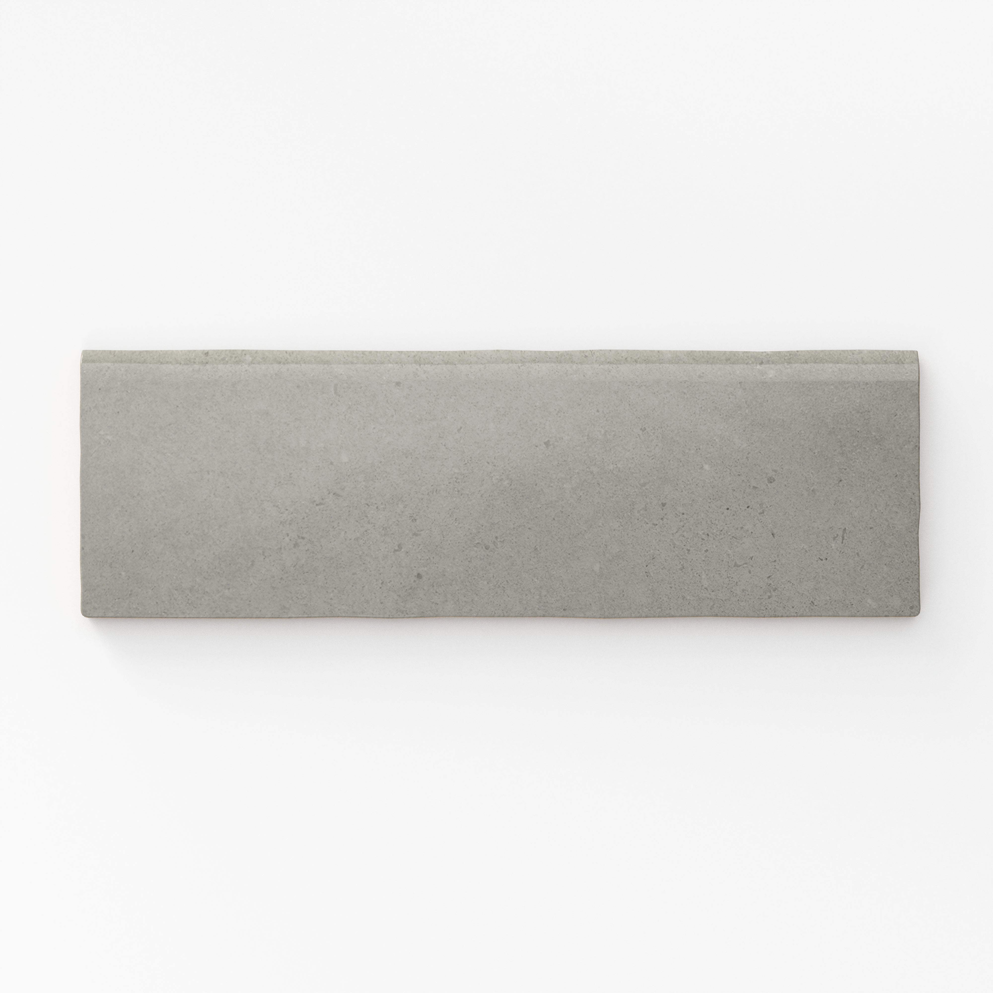 Matte pebble-gray bullnose tile with a smooth, understated finish, perfect for clean, modern edges