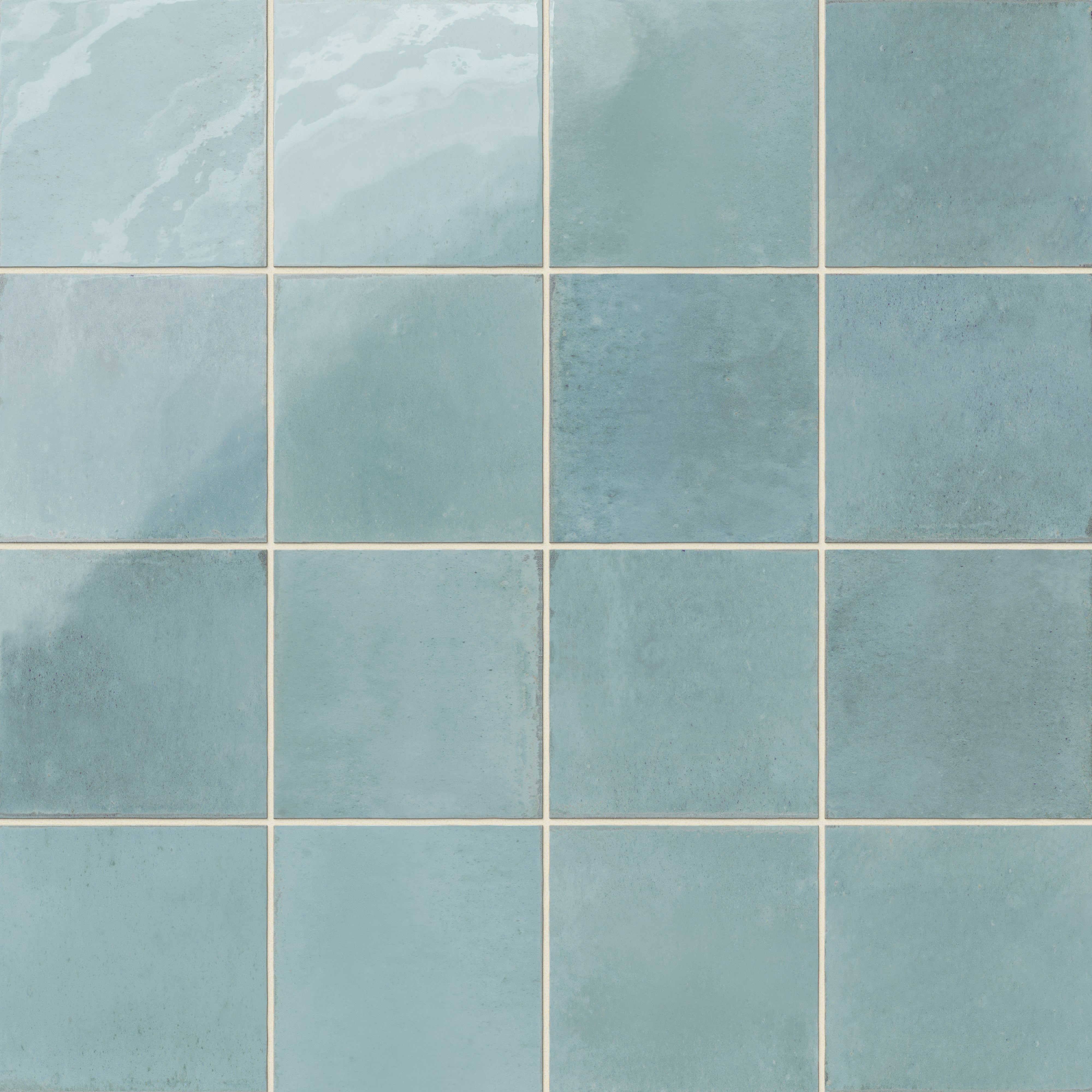 Light blue porcelain tiles featuring subtle shading and a timeworn, artisanal look.
