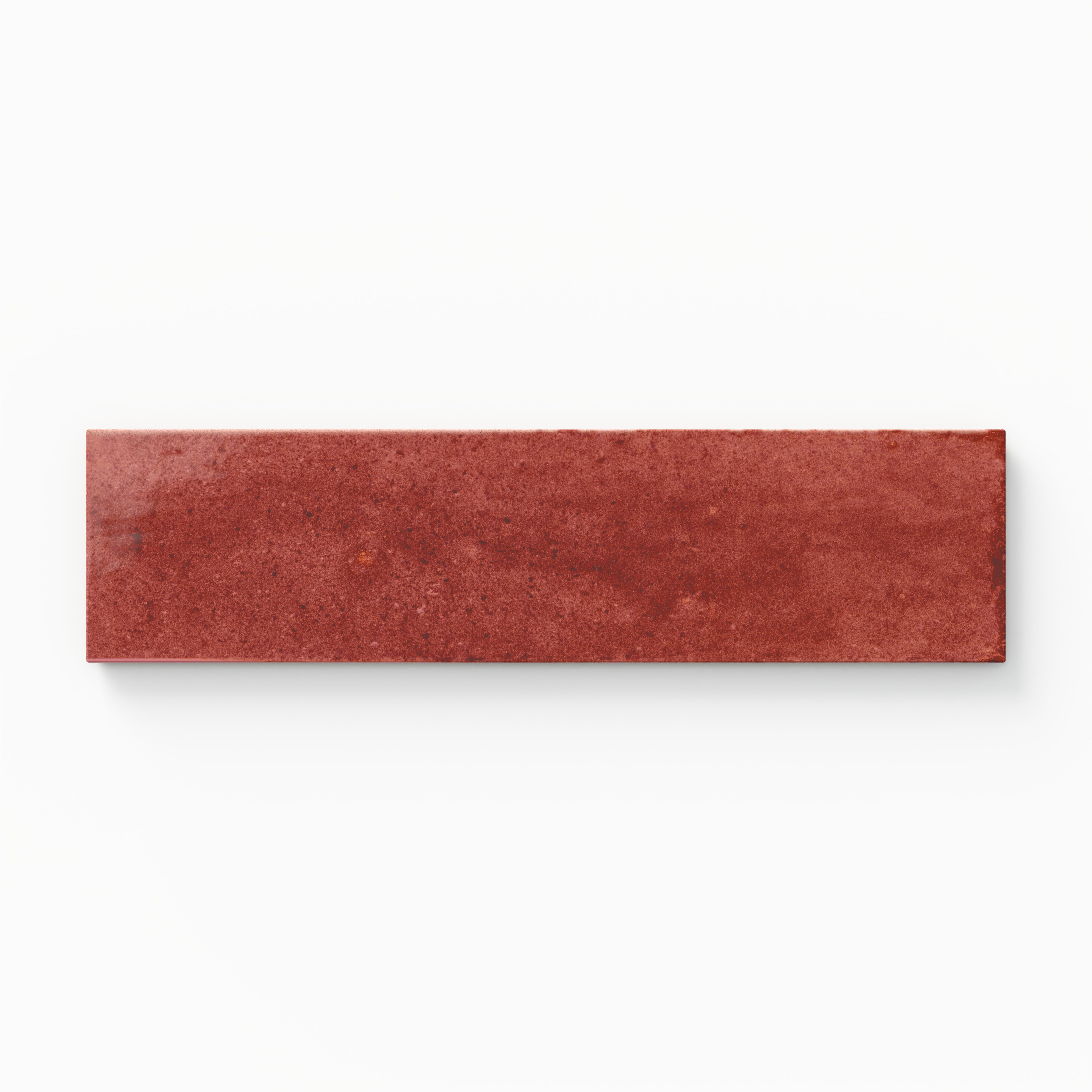 Rectangular porcelain tile in deep red color with a smooth glossy finish and subtle tonal variation.