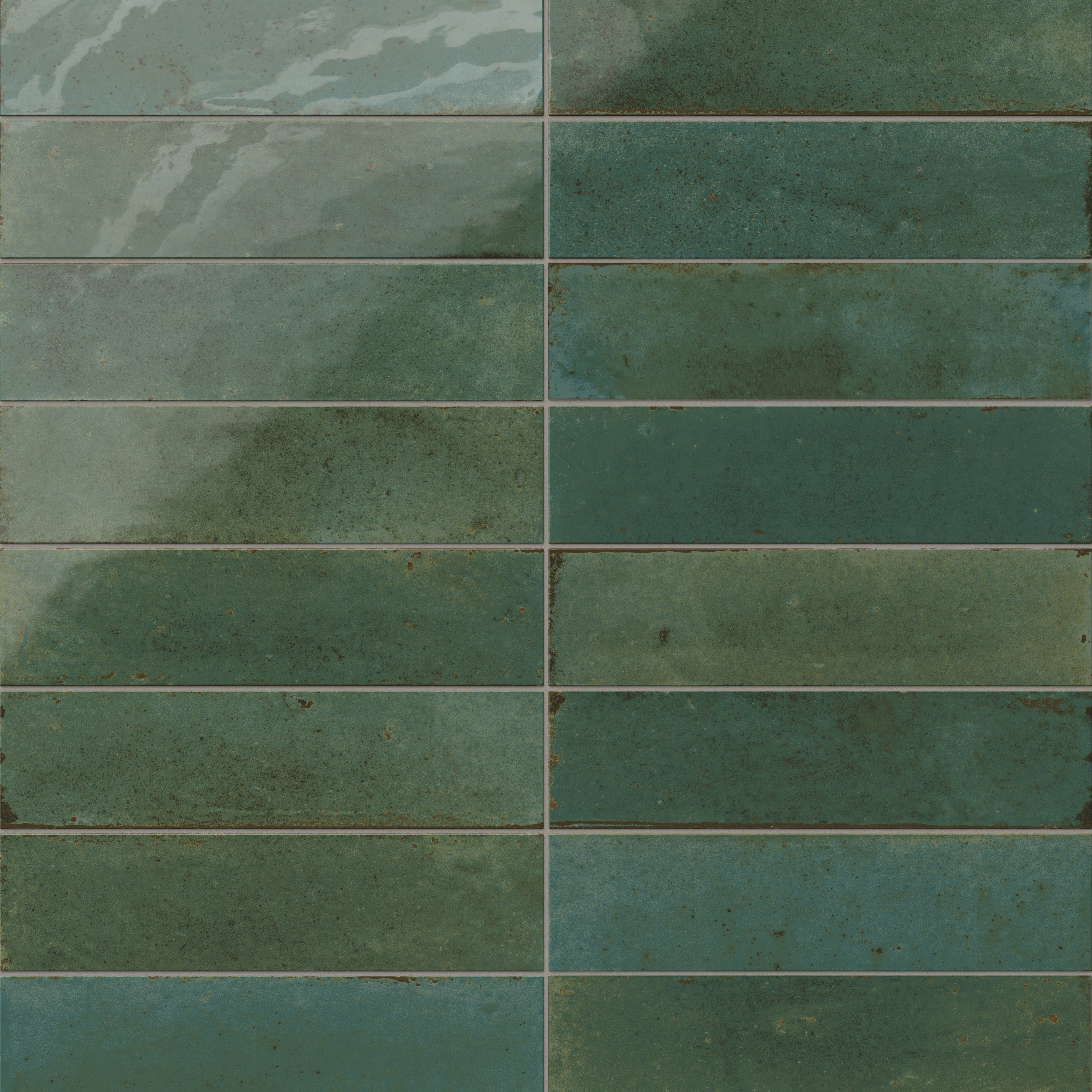 Subway porcelain tiles in a blend of light and dark green tones with a glazed finish.