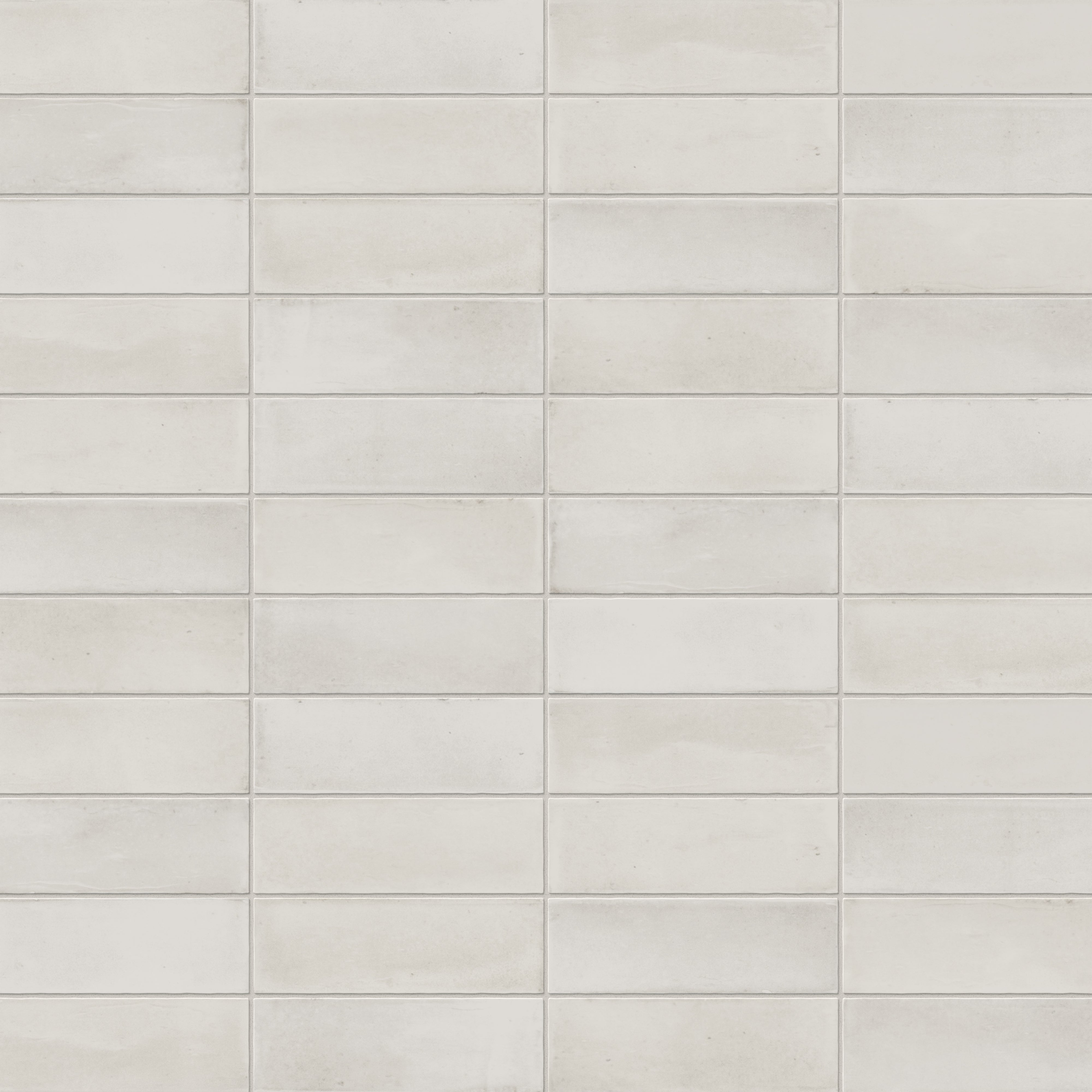 A 2x6 porcelain subway tile in soft off-white, featuring a matte finish, and a clean stacked layout with fine grout lines.