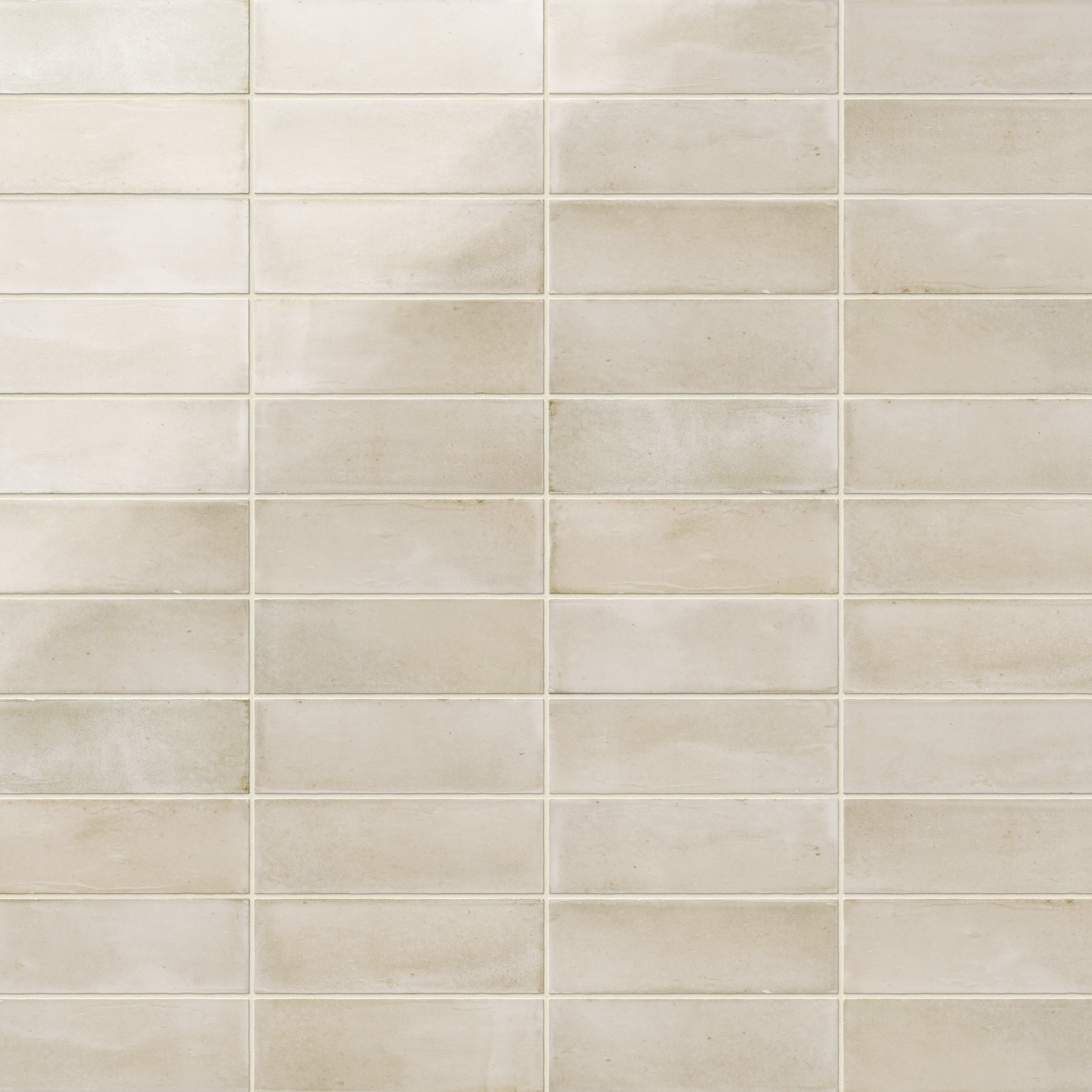 A 2x6 porcelain subway tile in soft beige, featuring a glossy finish, and a clean stacked layout with fine grout lines.