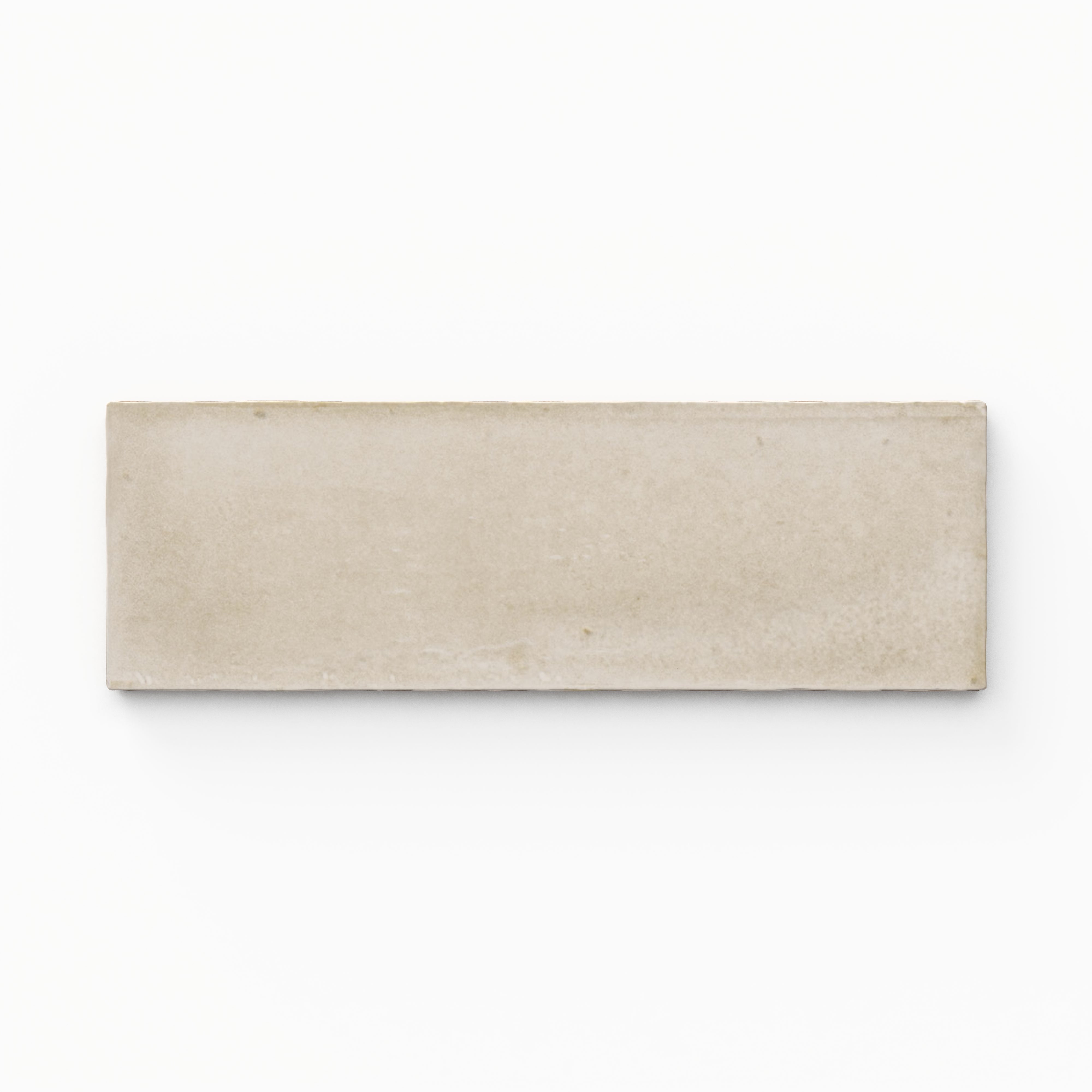 A 2x6 porcelain tile in beige, featuring a matte finish, soft tonal variation, and a clean, flat-edge profile.