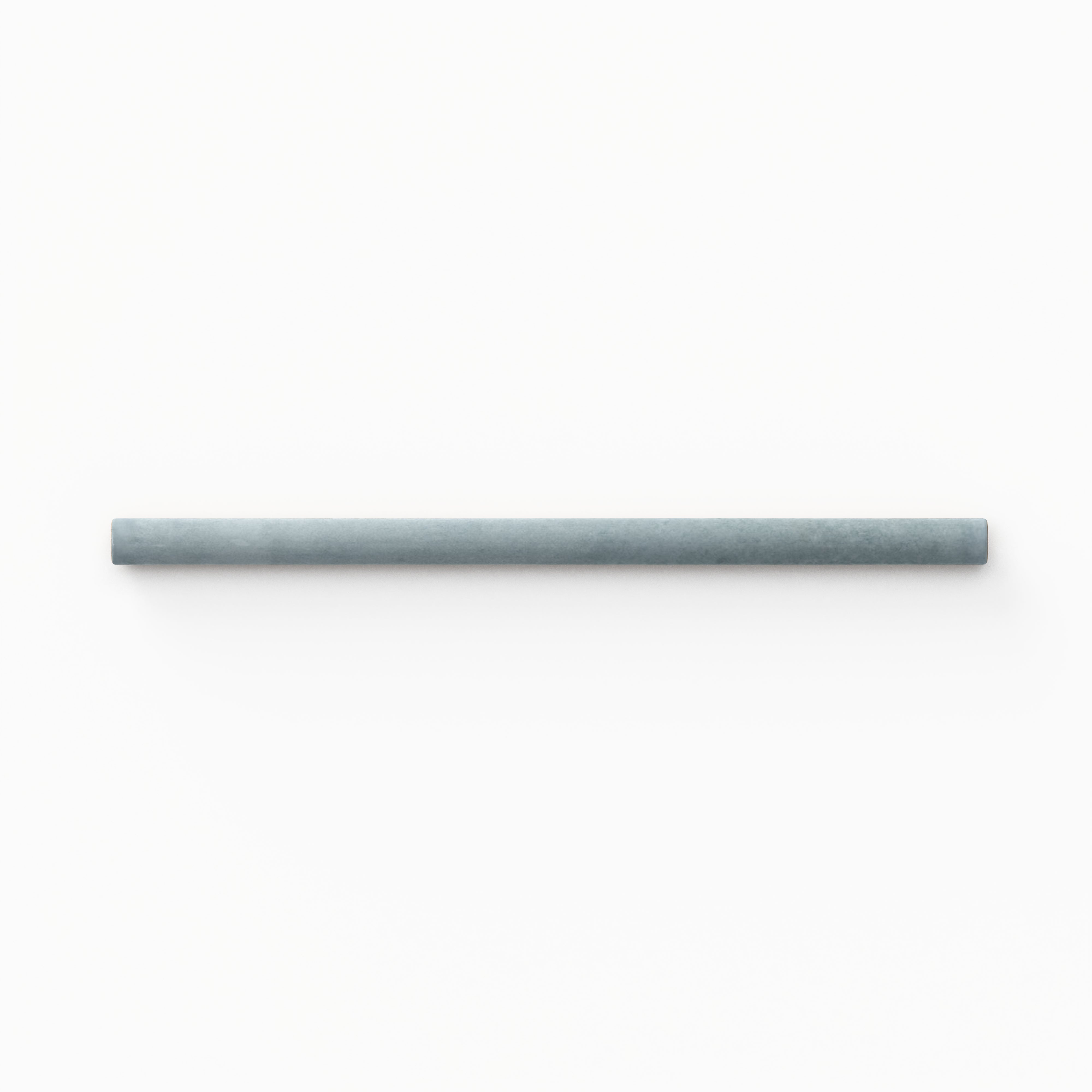 A 0.5x8 ceramic tile trim in light blue featuring a glossy finish, and softly curved profile for elegant edging.