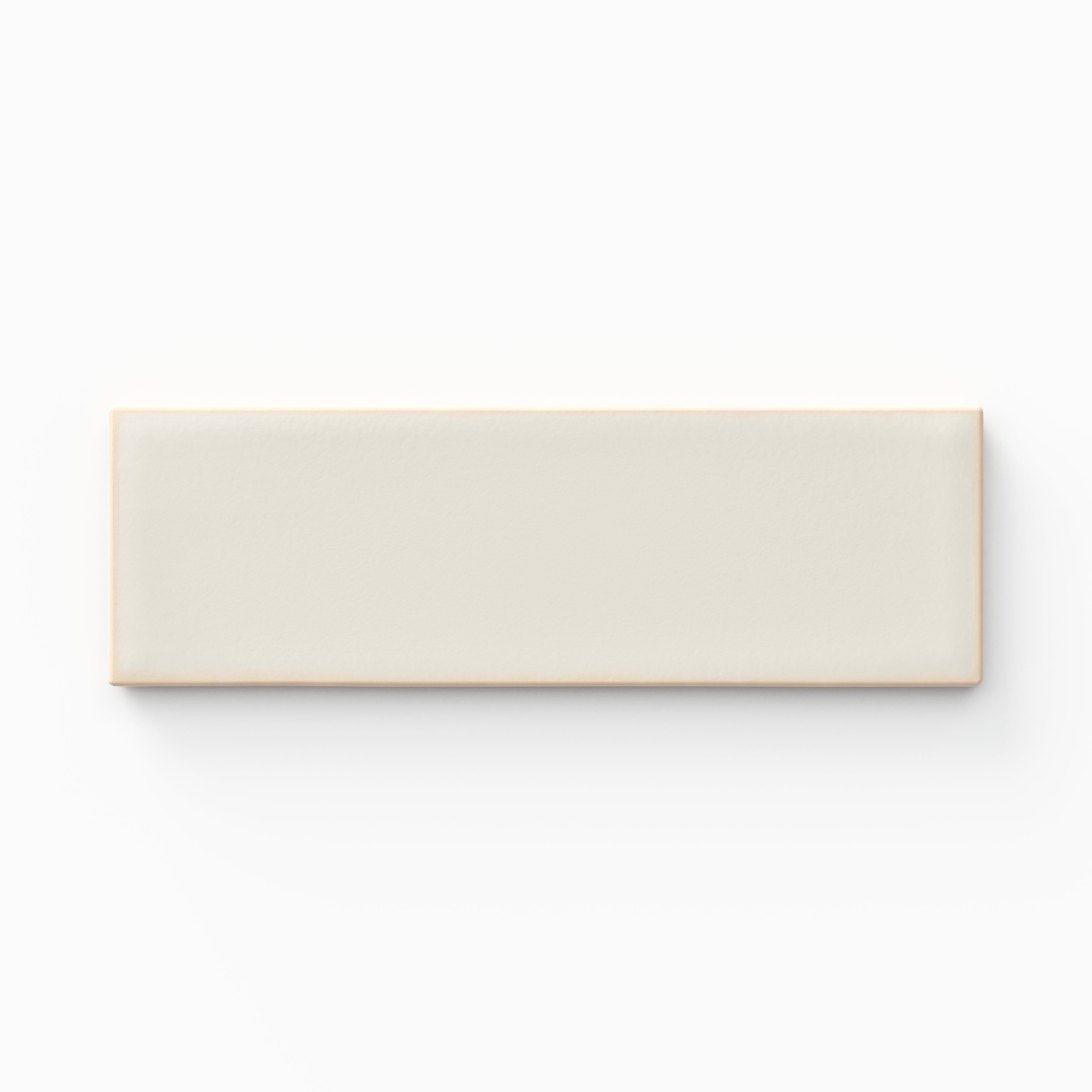 A 1.6x5 ceramic tile in warm off-white, featuring a matte finish, soft tonal variation, and a clean, flat-edge profile.